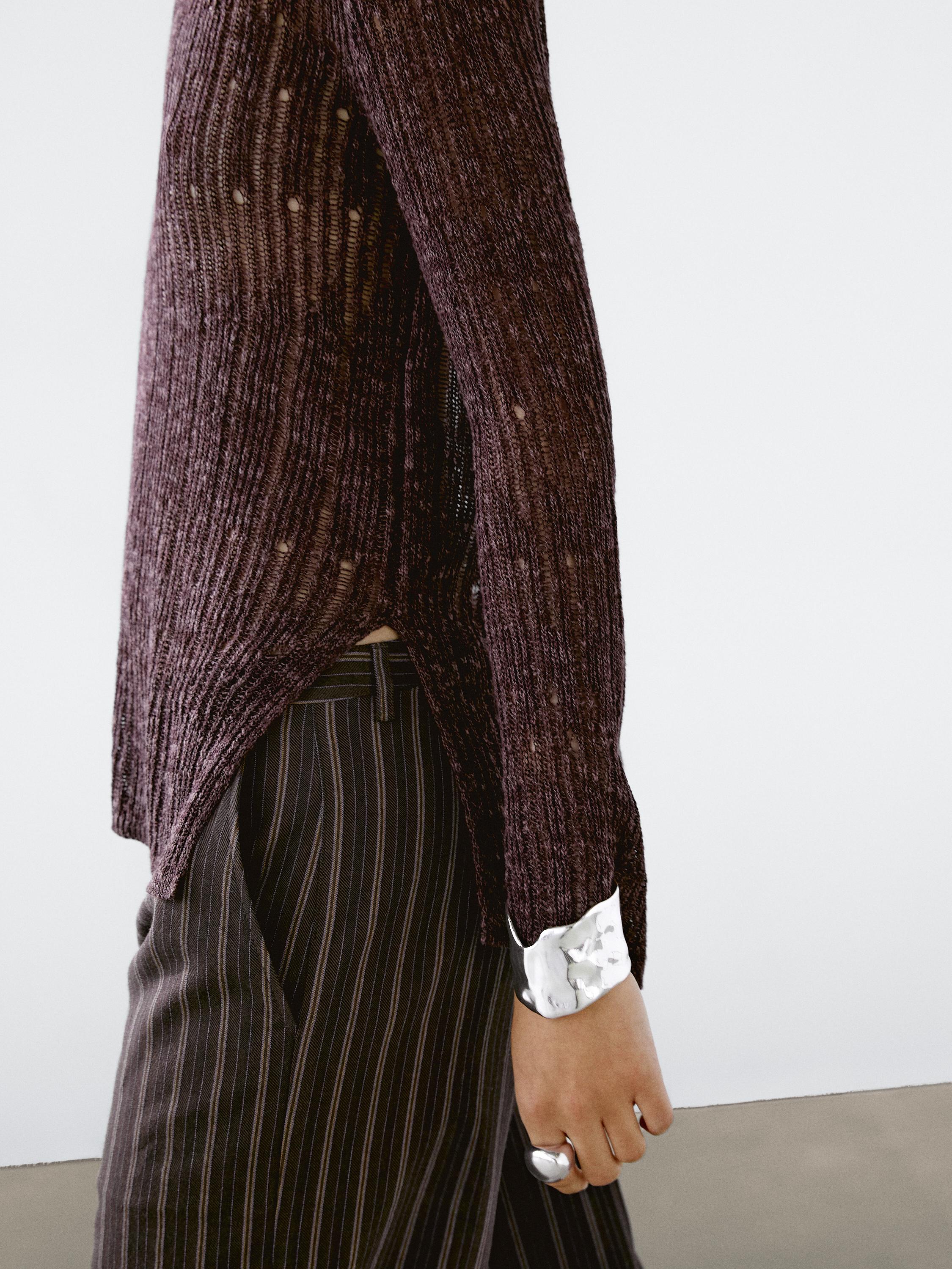 Asymmetric cutwork sweater