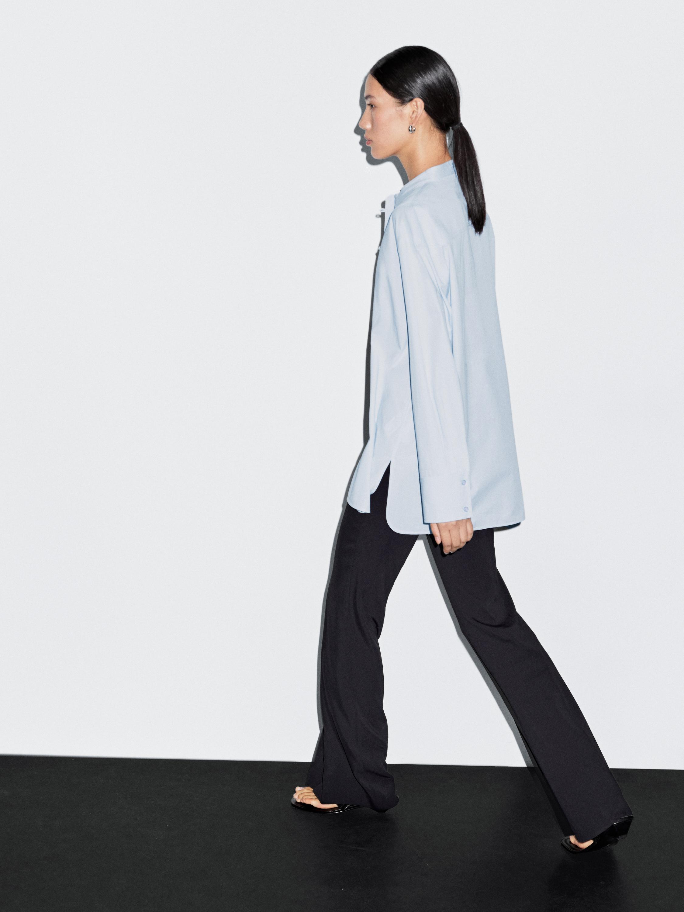 Shirt with stand collar and bib