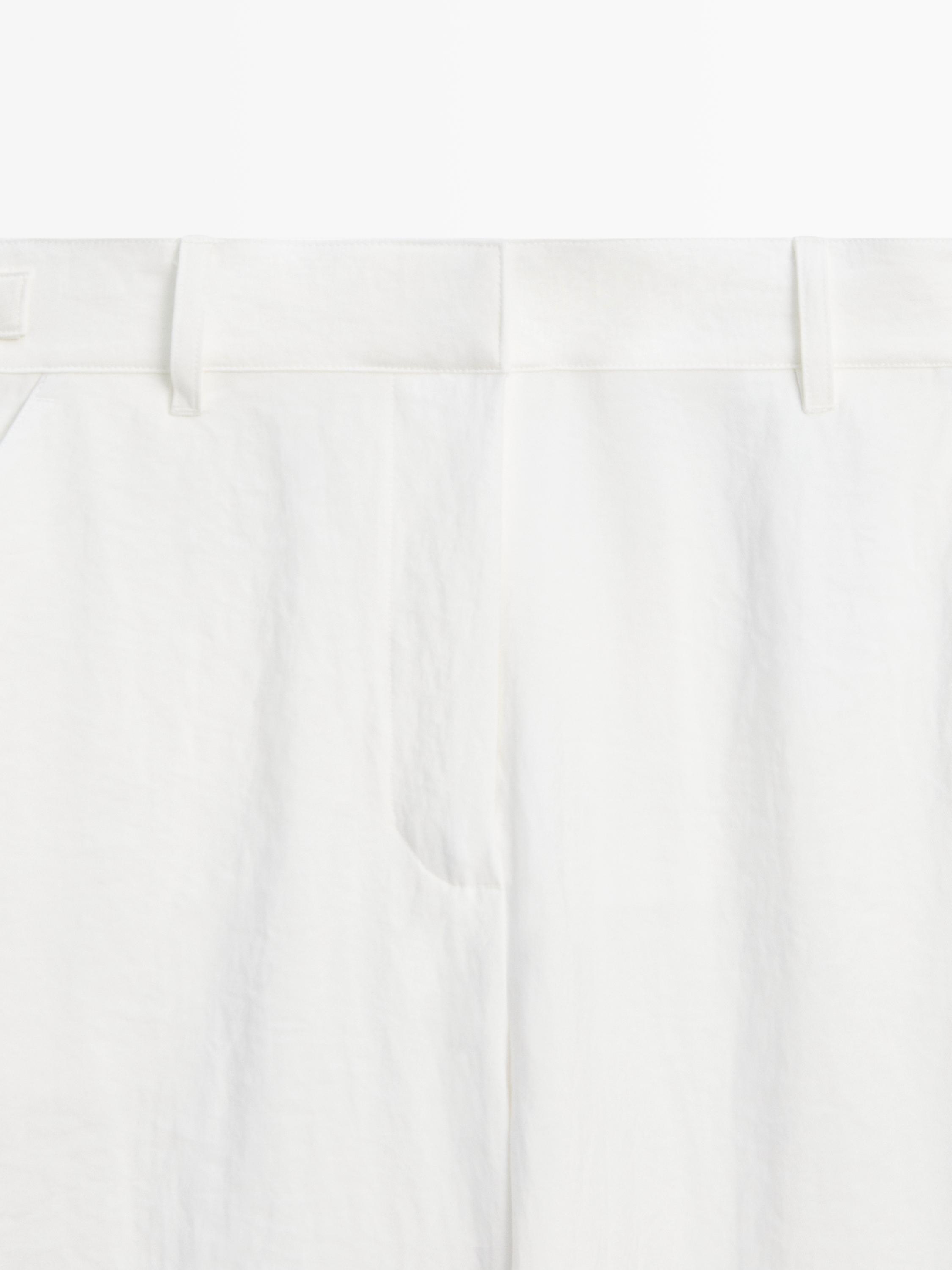 Flowing trousers with buckles — WHITE