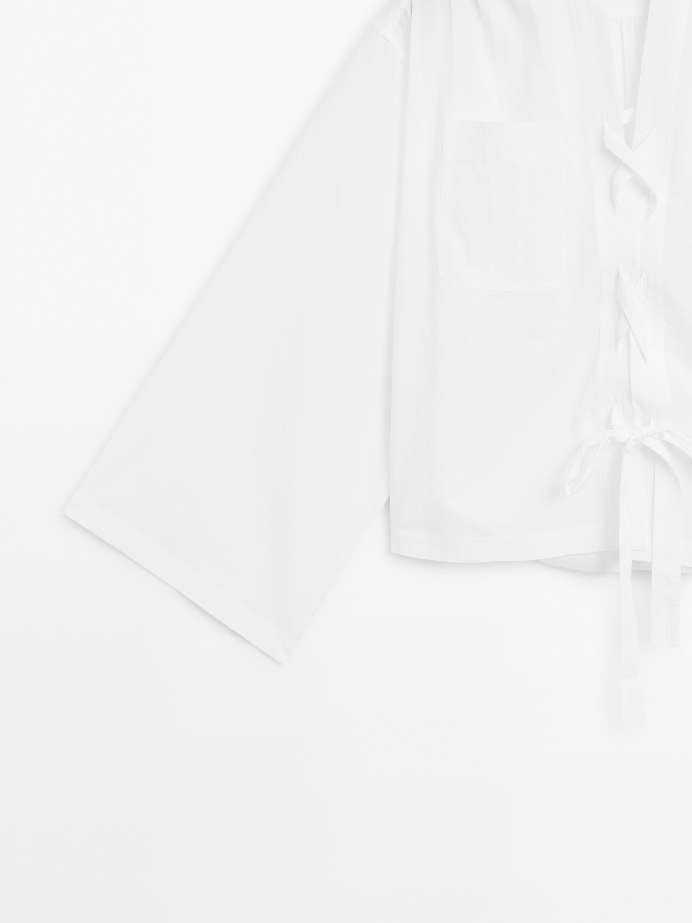 Stand collar blouse with tie detail