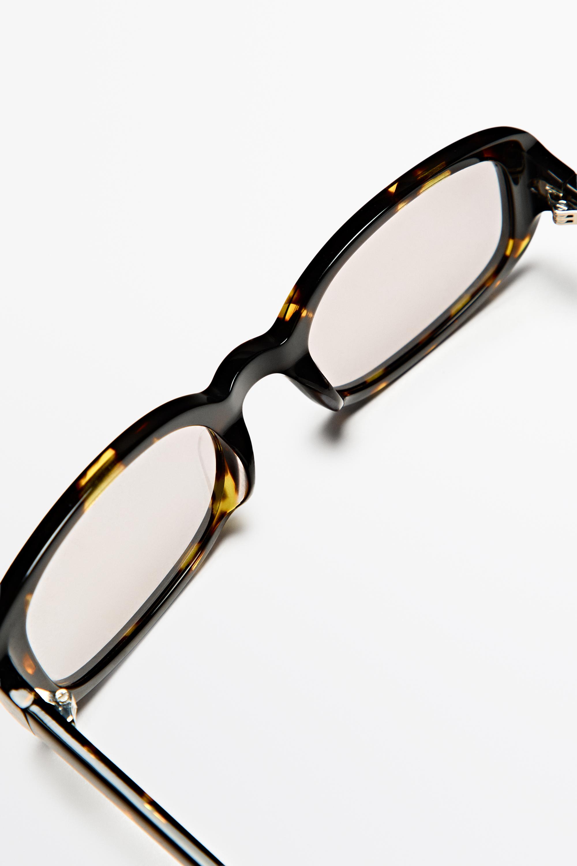 Oval tortoiseshell-effect sunglasses — BROWN