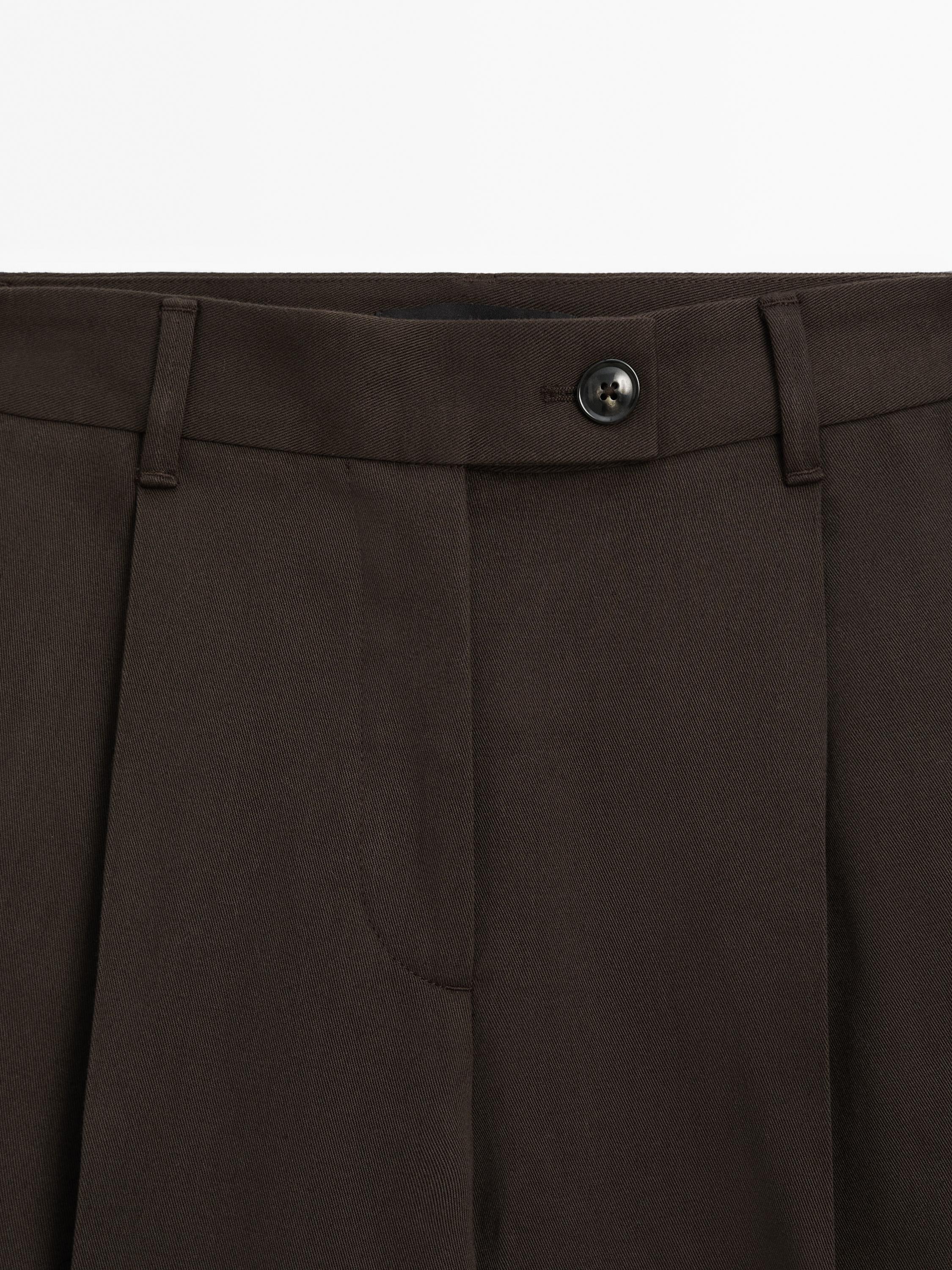 Wide-leg pleated cotton blend trousers