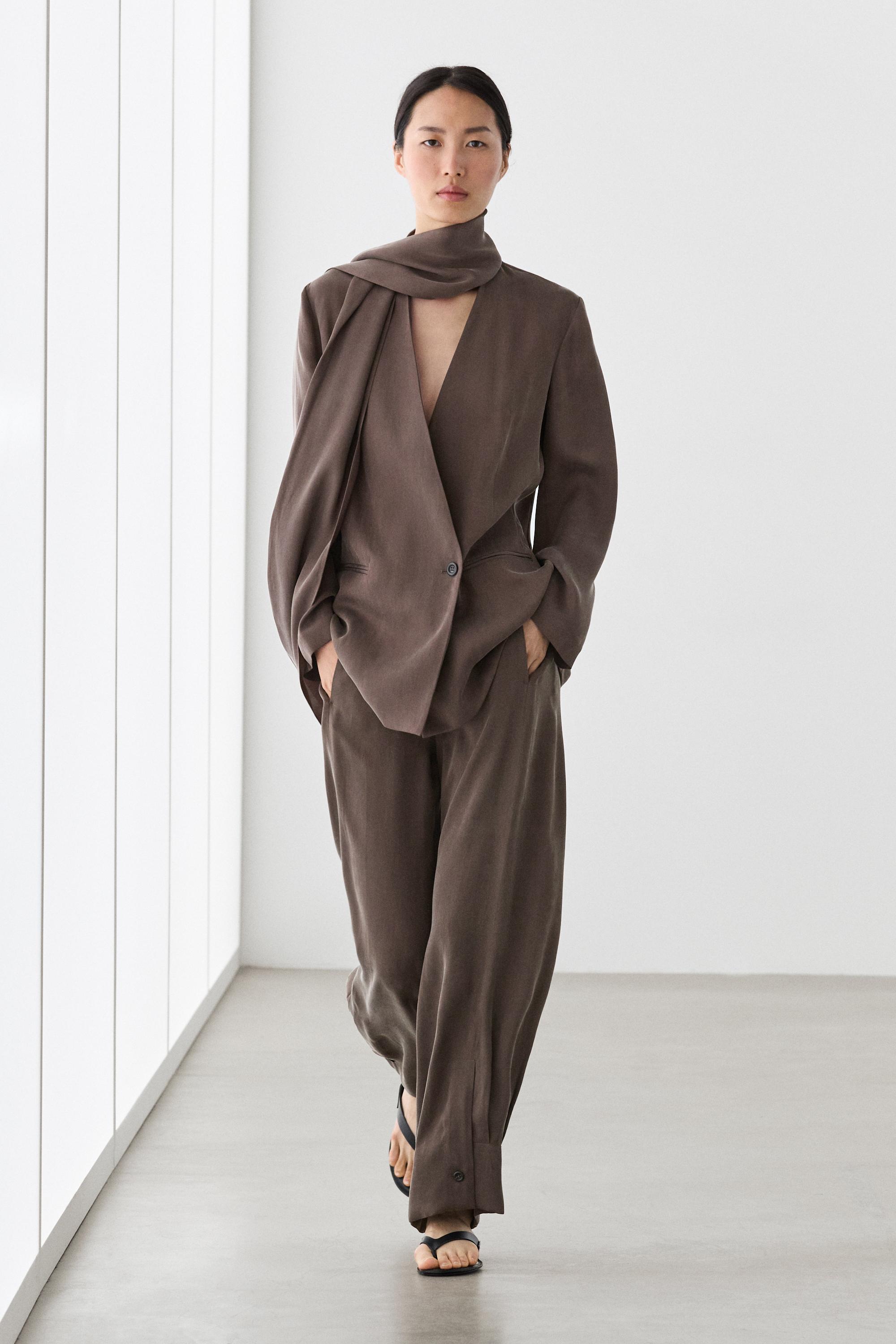 Total look flowing trousers with buttoned hems — PLUM