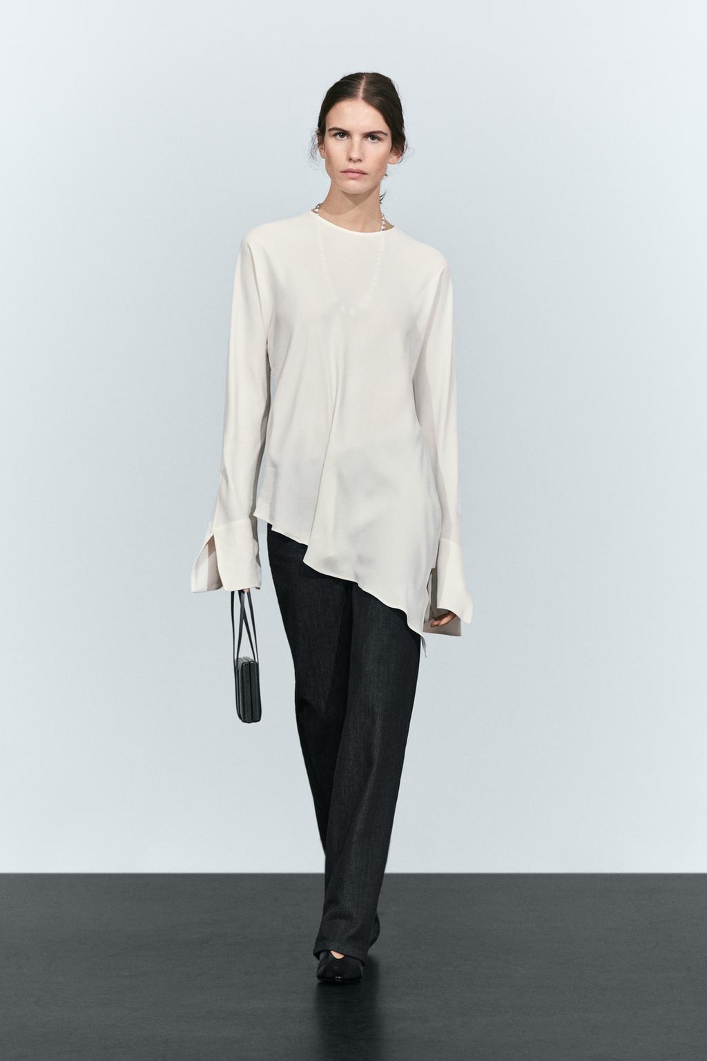 Fluid asymmetric blouse with batwing sleeve