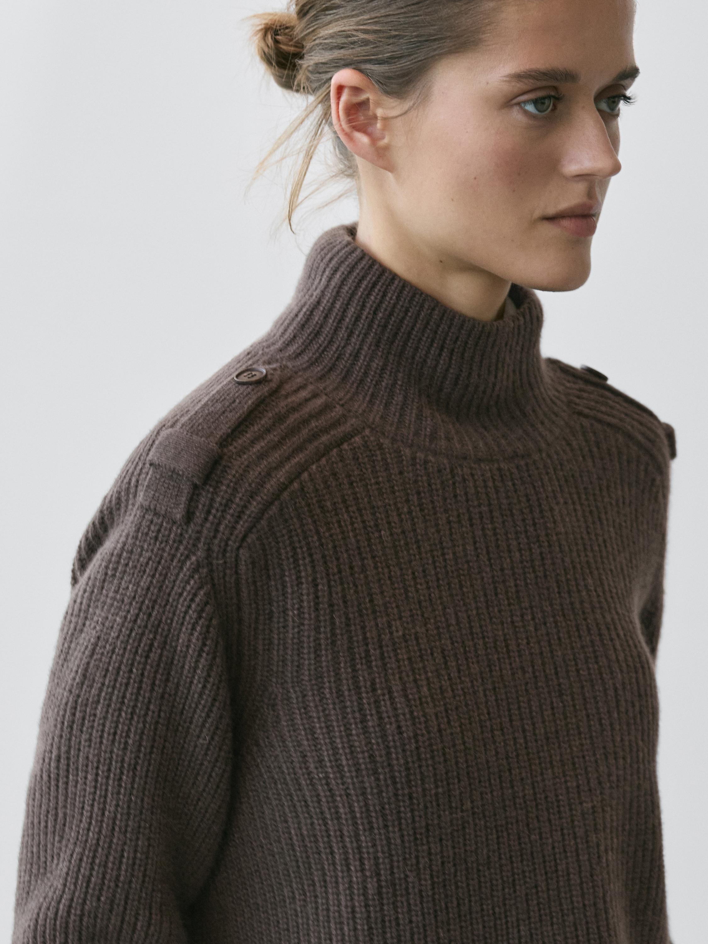 Knit sweater with shoulder detail