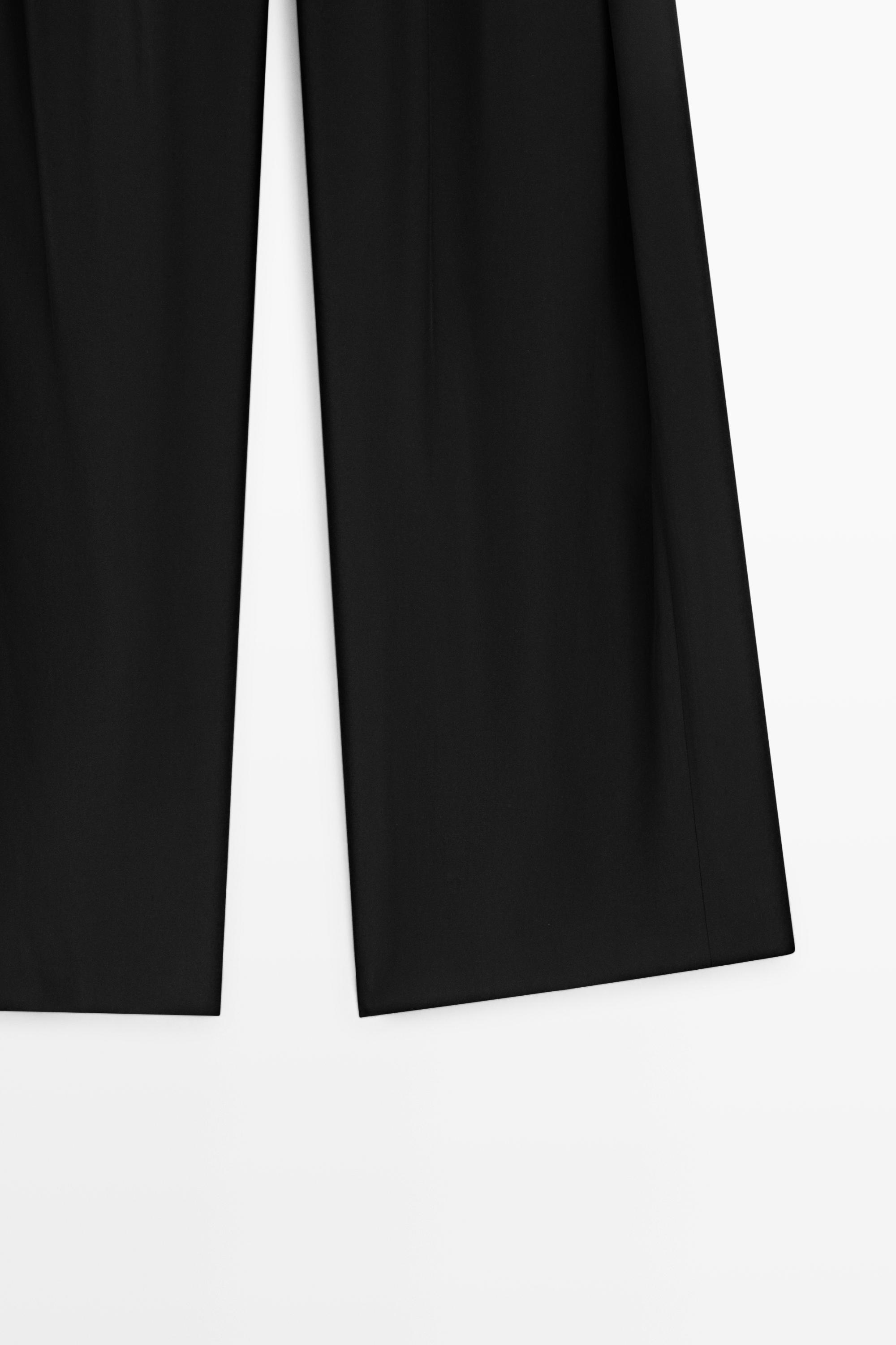 Flowing pleated pants with button detail — BLACK