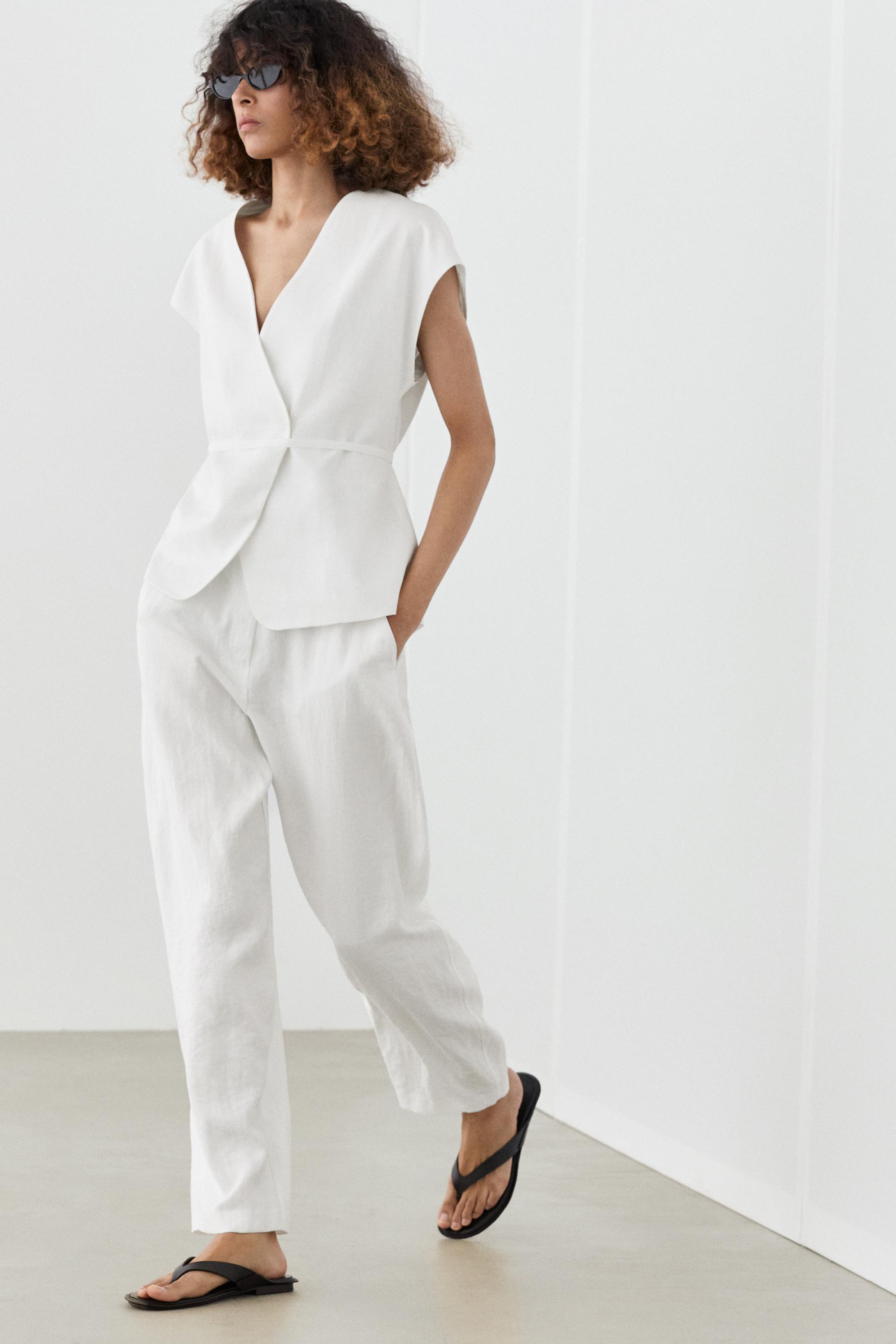 Flowing trousers with buckles — WHITE