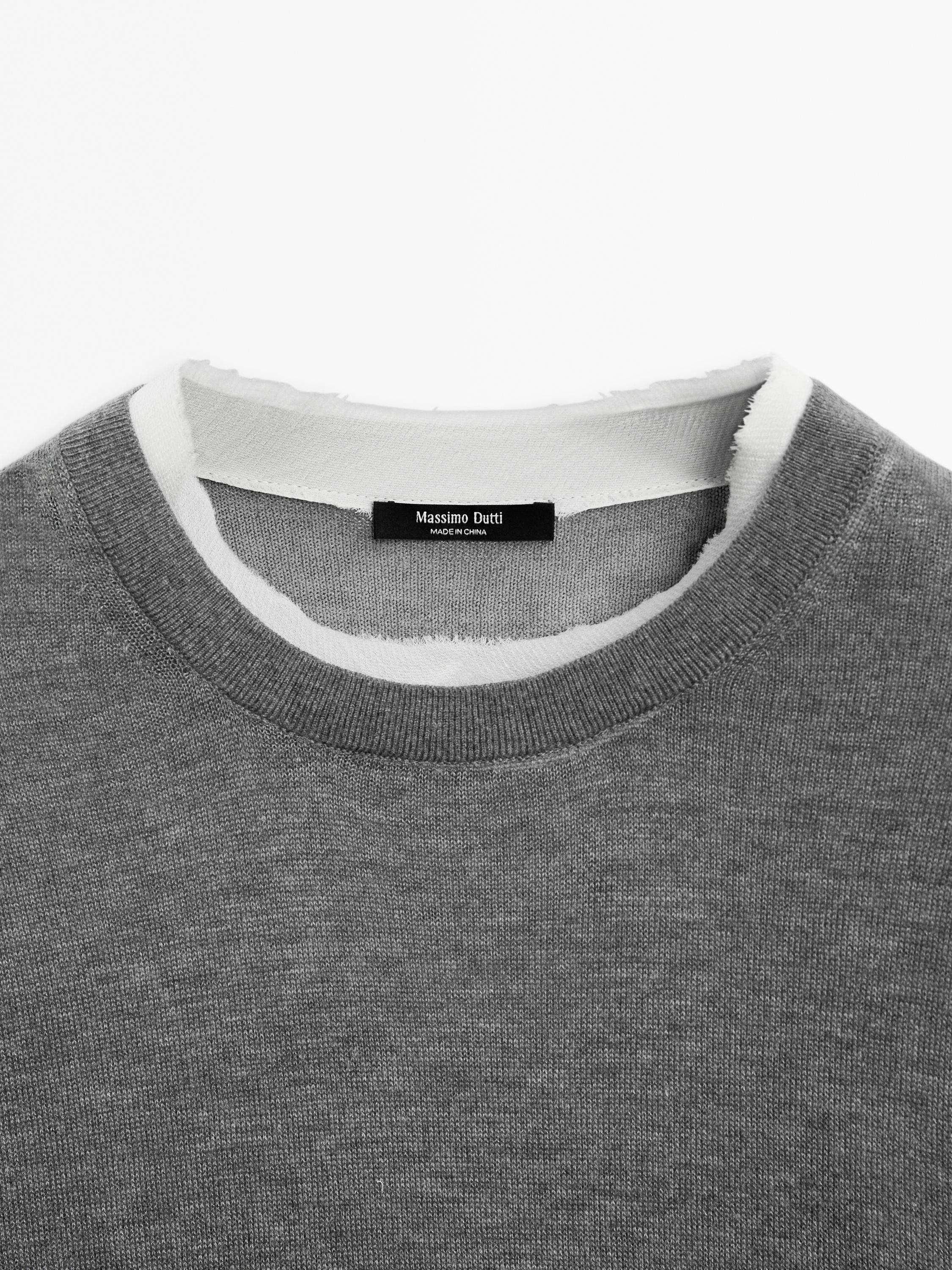 Knit sweater with short sleeves and distressed detail