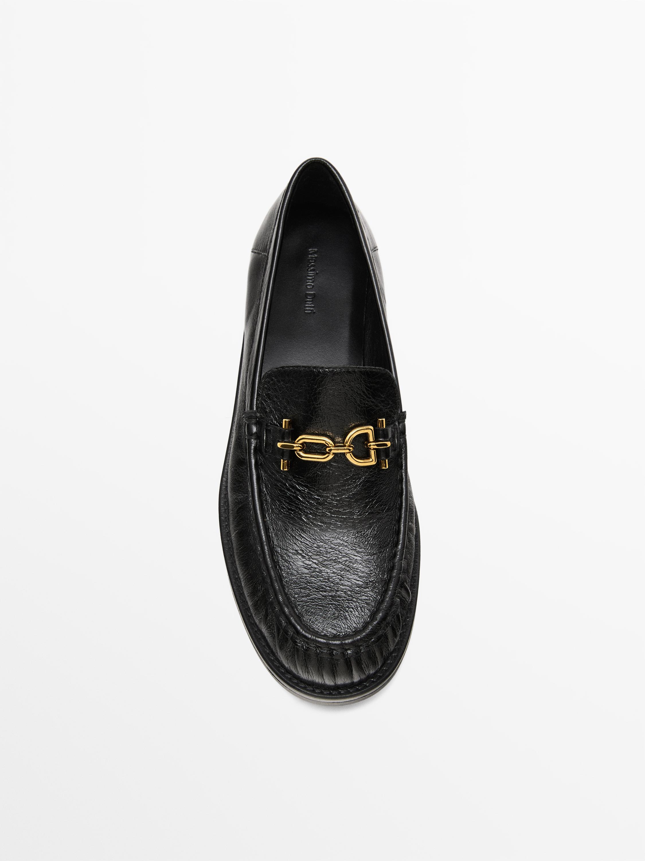 Crackled leather loafers with decorative detail