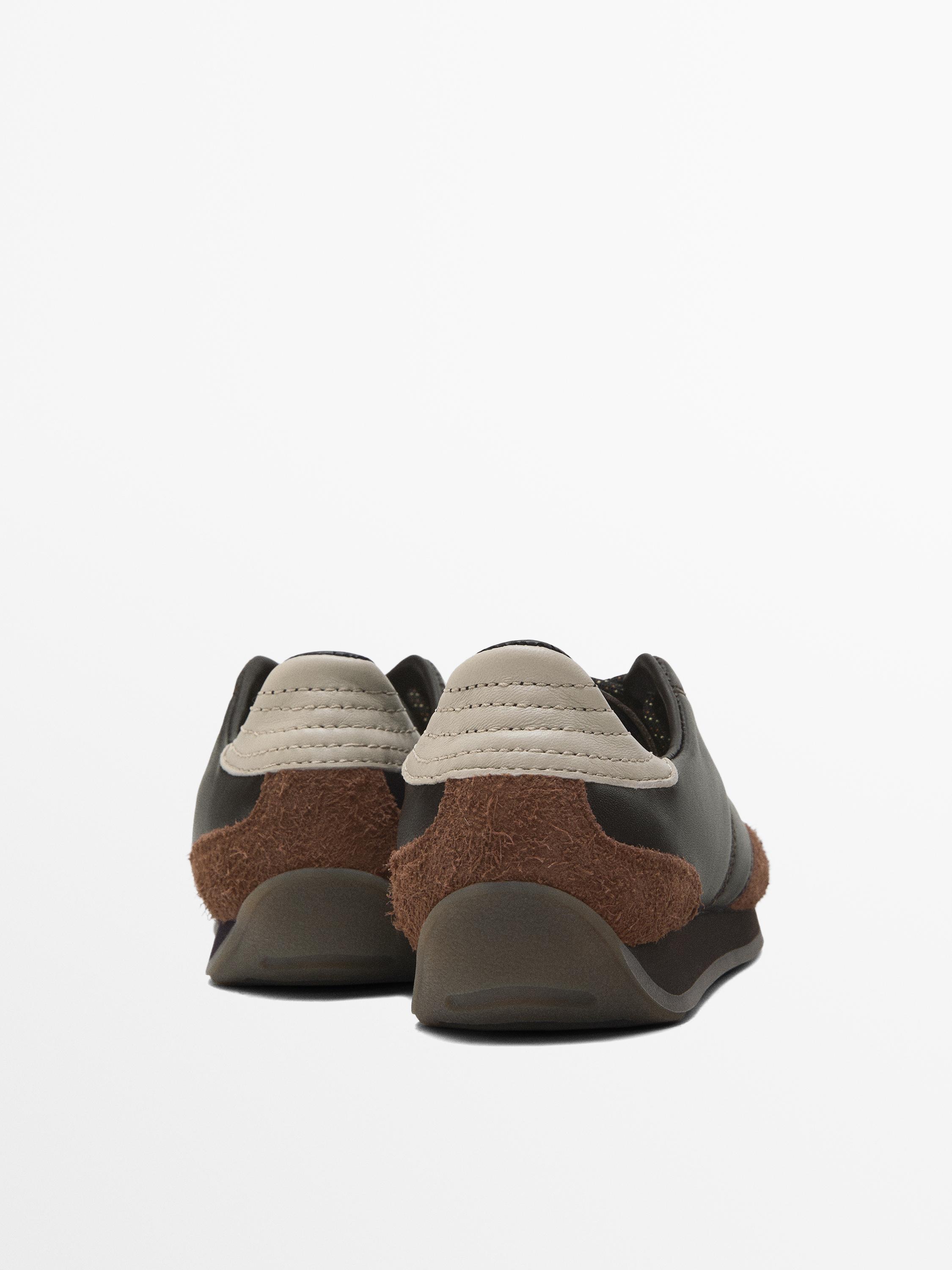 Leather trainers with contrast pieces