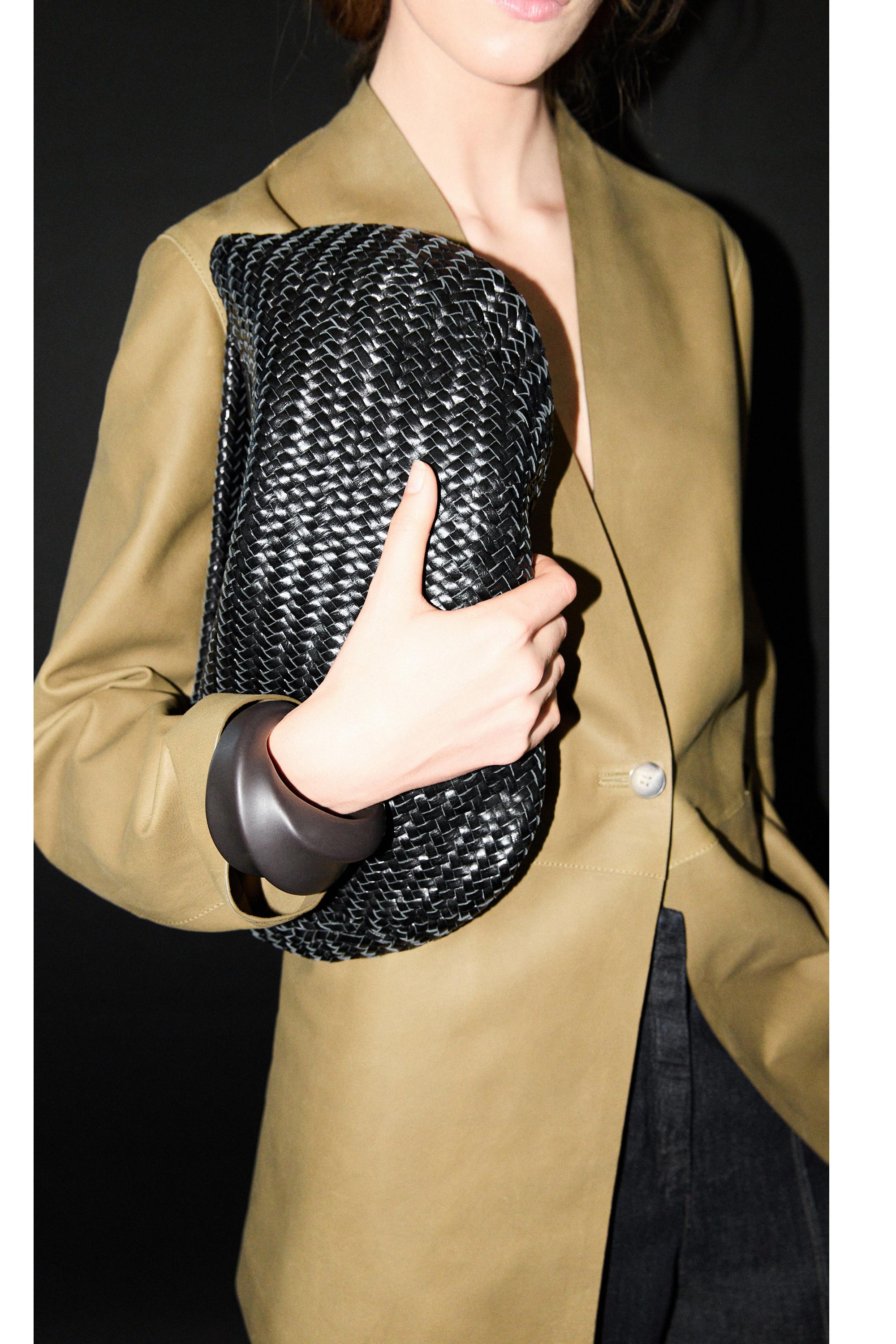 Braided leather half-moon bag — BLACK