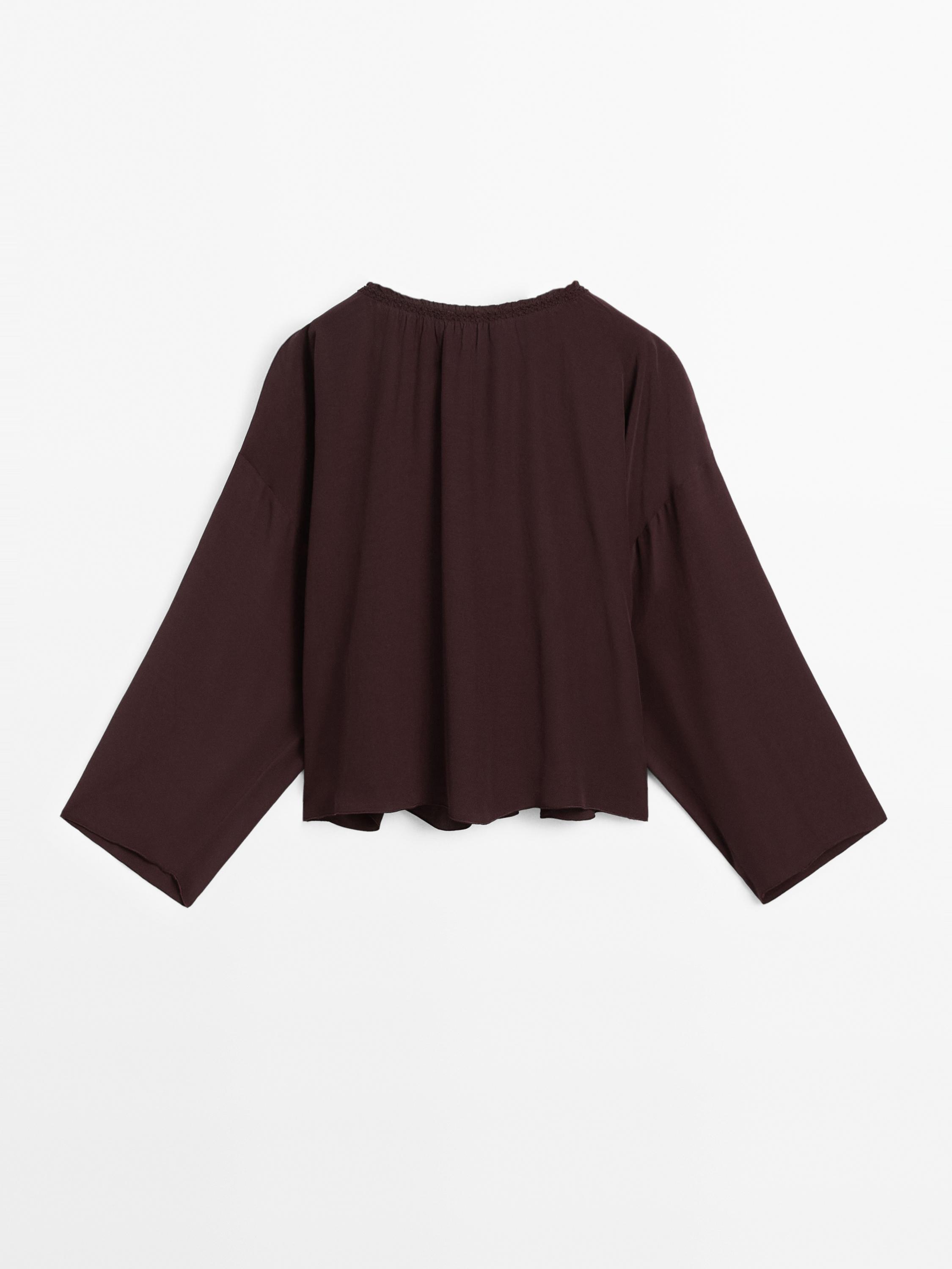 Flowing blouse with gathered detail