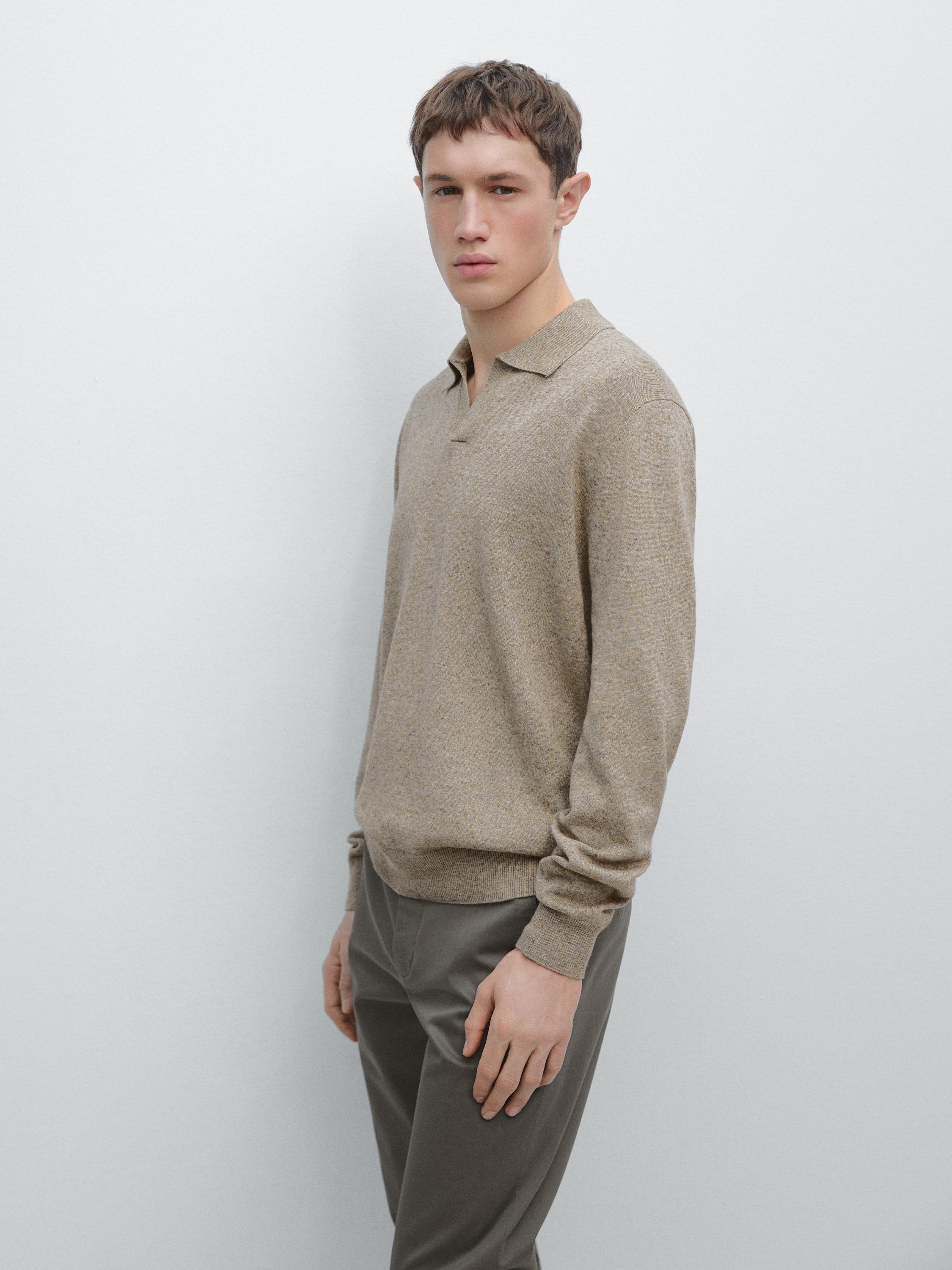 Mink long-sleeve polo neck sweater and gray pants set.