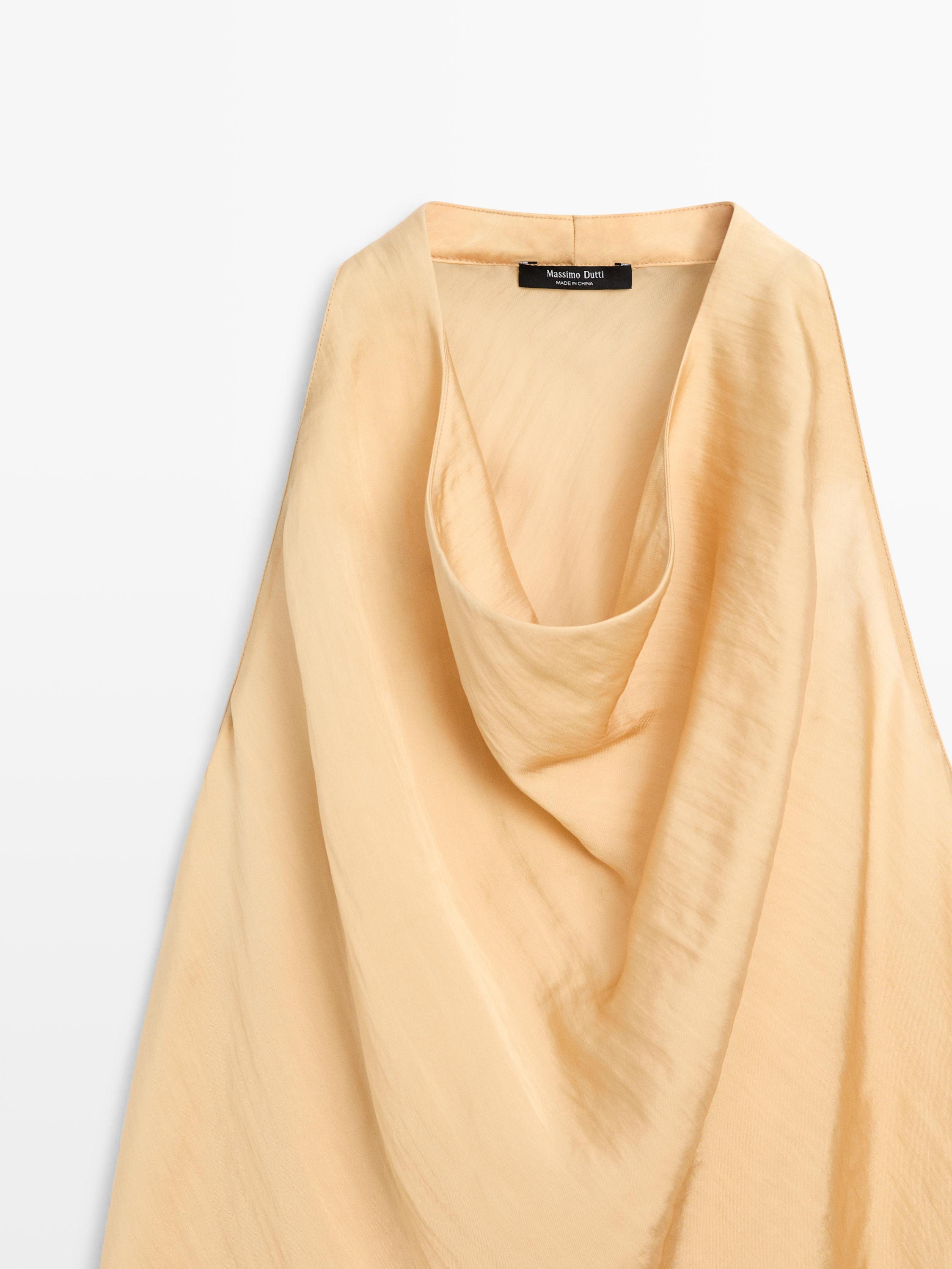 Fitted top with a draped neckline