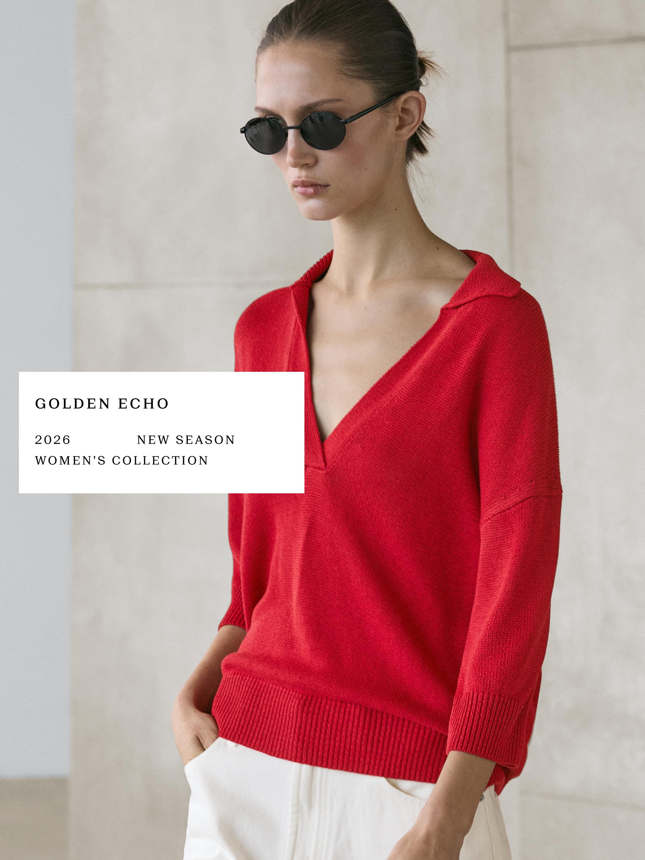 Plano medio de jersey rojo con cuello polo y mangas tres cuartos. Texto visible: "GOLDEN ECHO 2026 NEW SEASON WOMEN'S COLLECTION".
