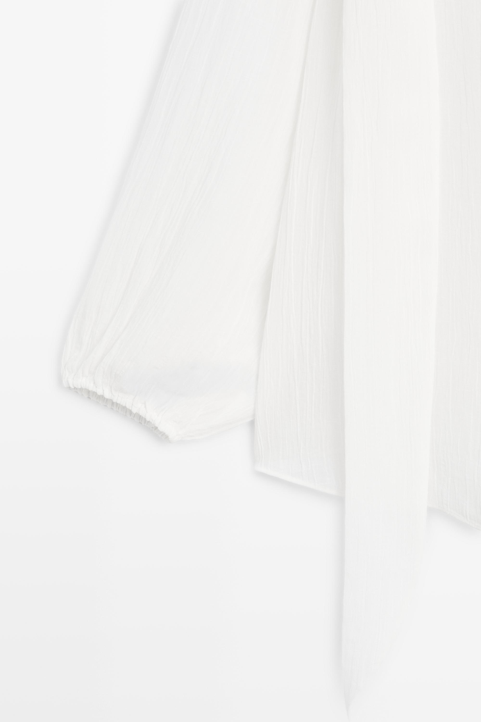 Flowing V-neck blouse with tie — WHITE
