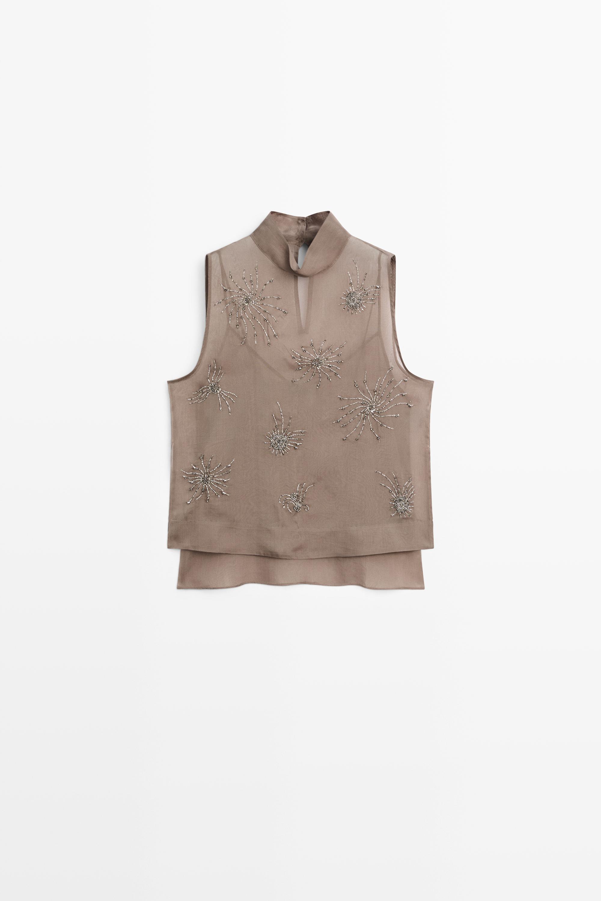 Top semi-transparent avec broderies