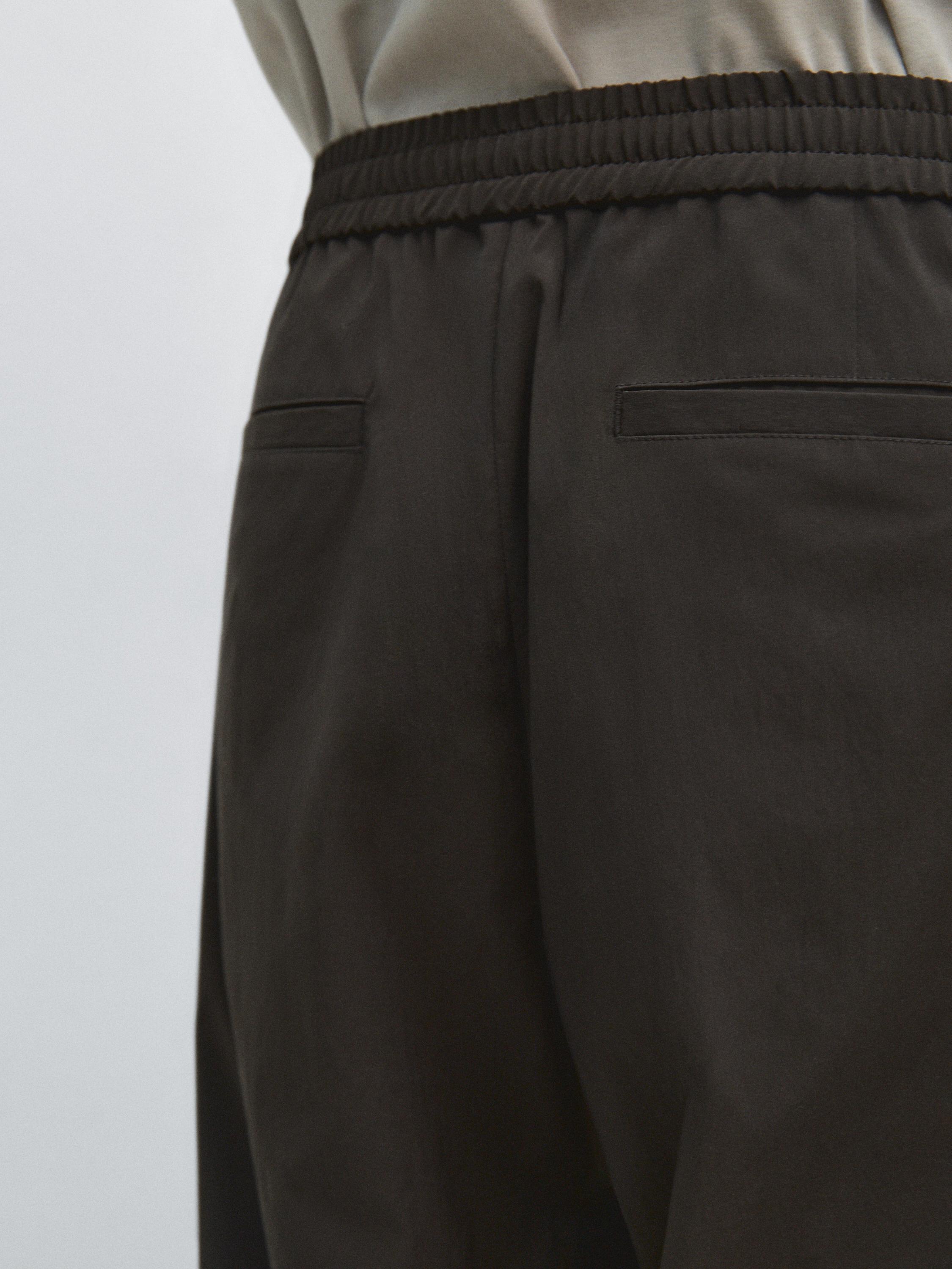 Total look technical trousers — BROWN