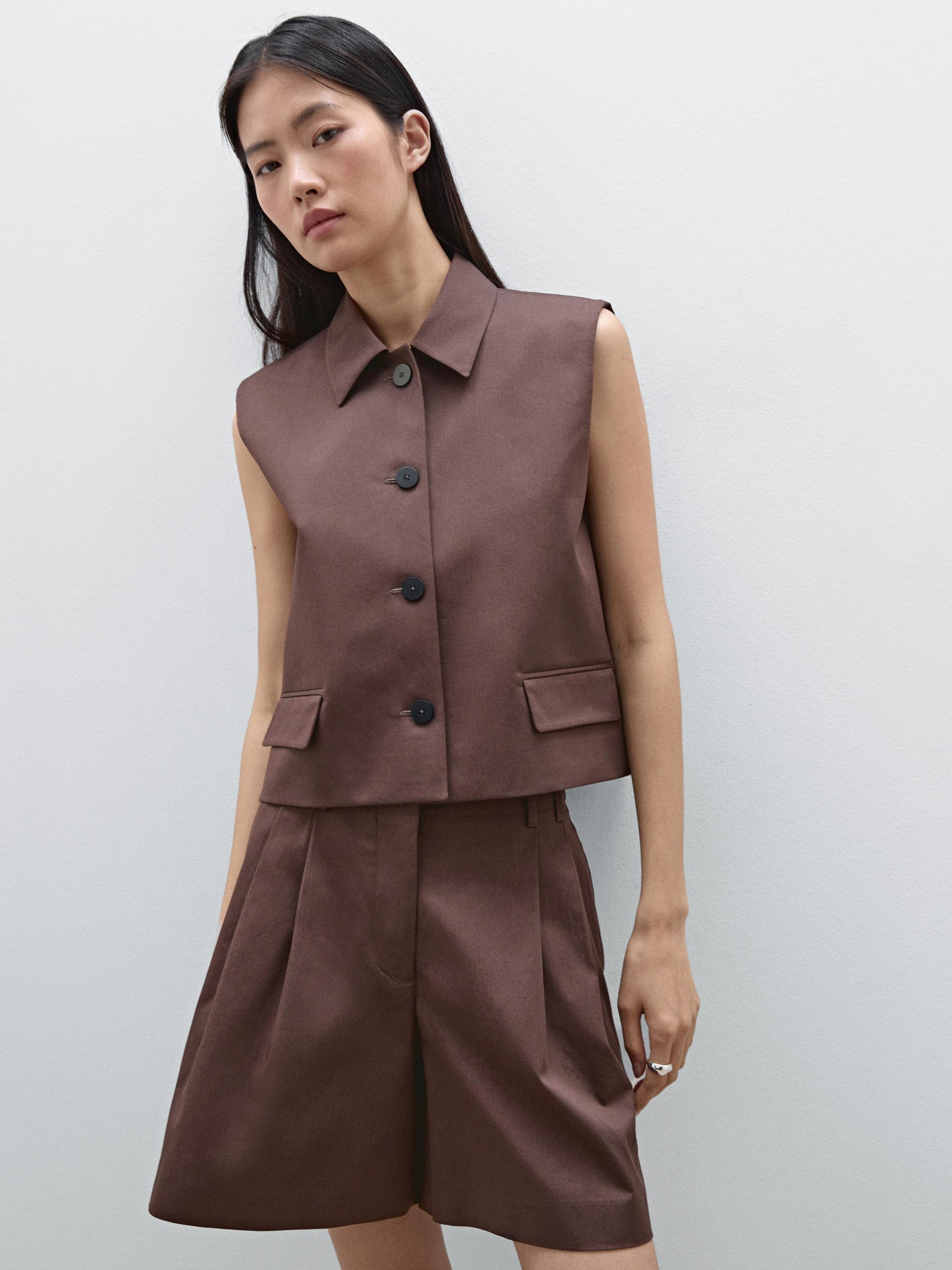 Button-down, sleeveless brown vest and matching shorts set