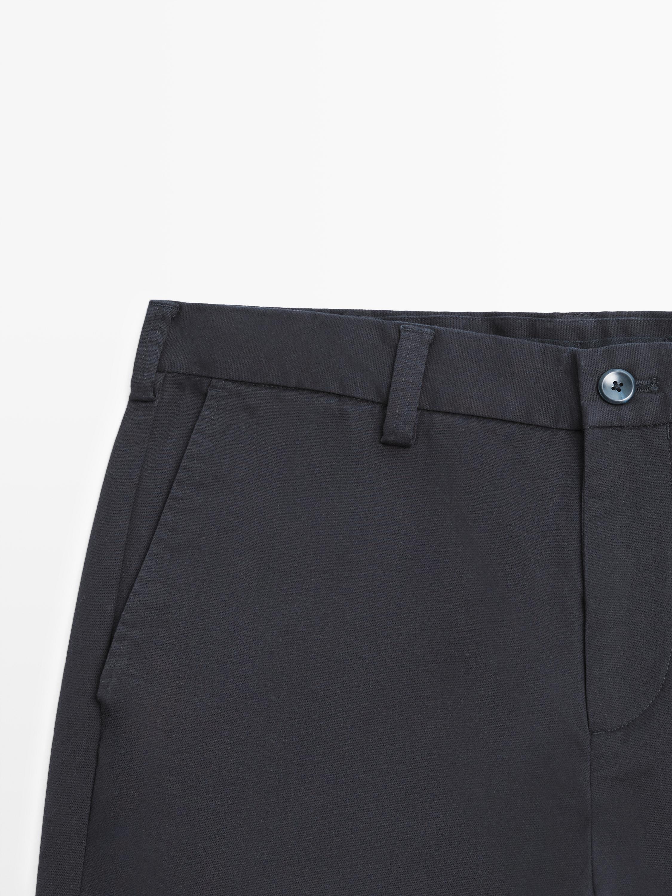 Tapered fit micro textured trousers — NAVY BLUE