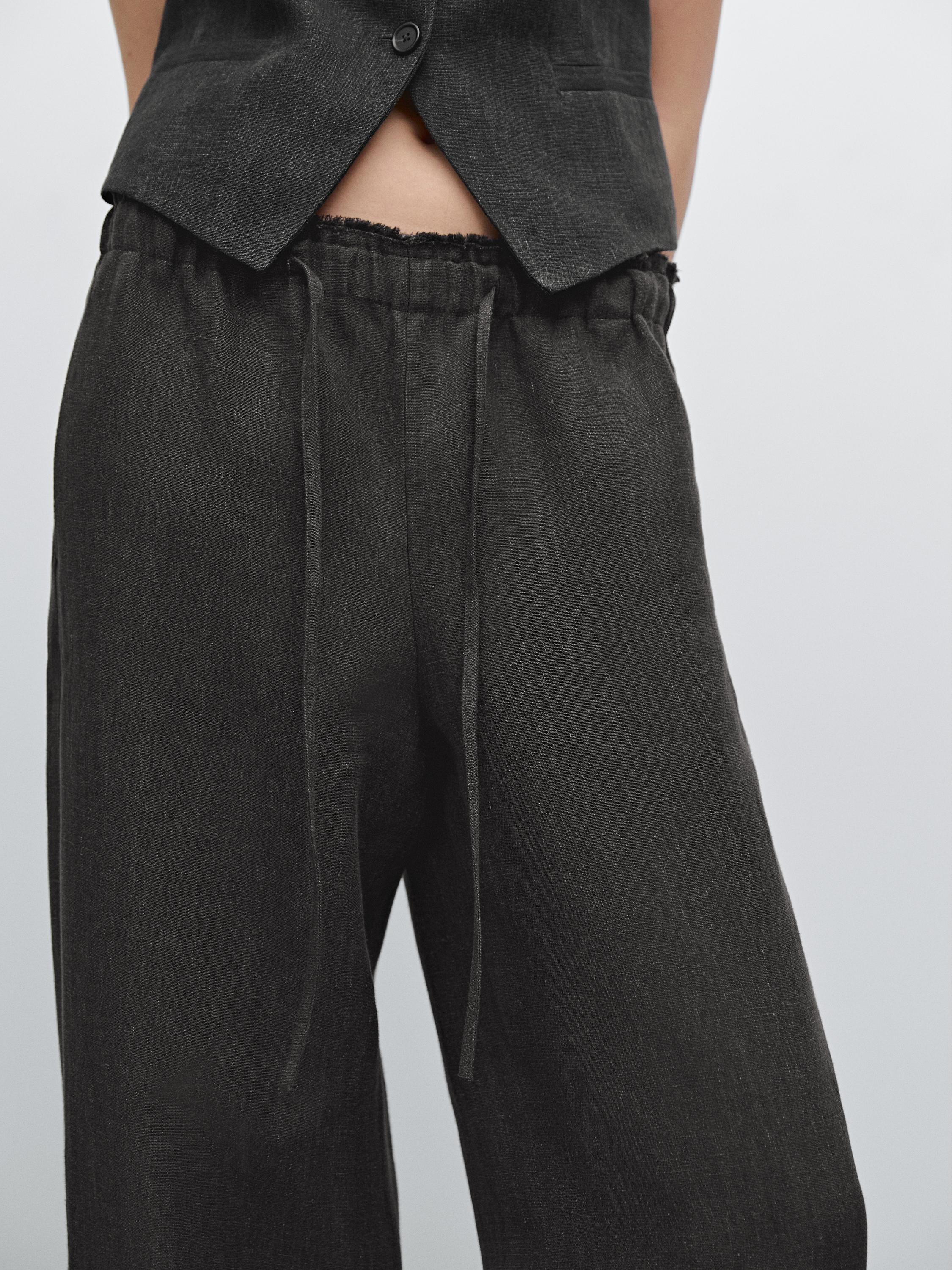 Linen suit trousers with frayed detail