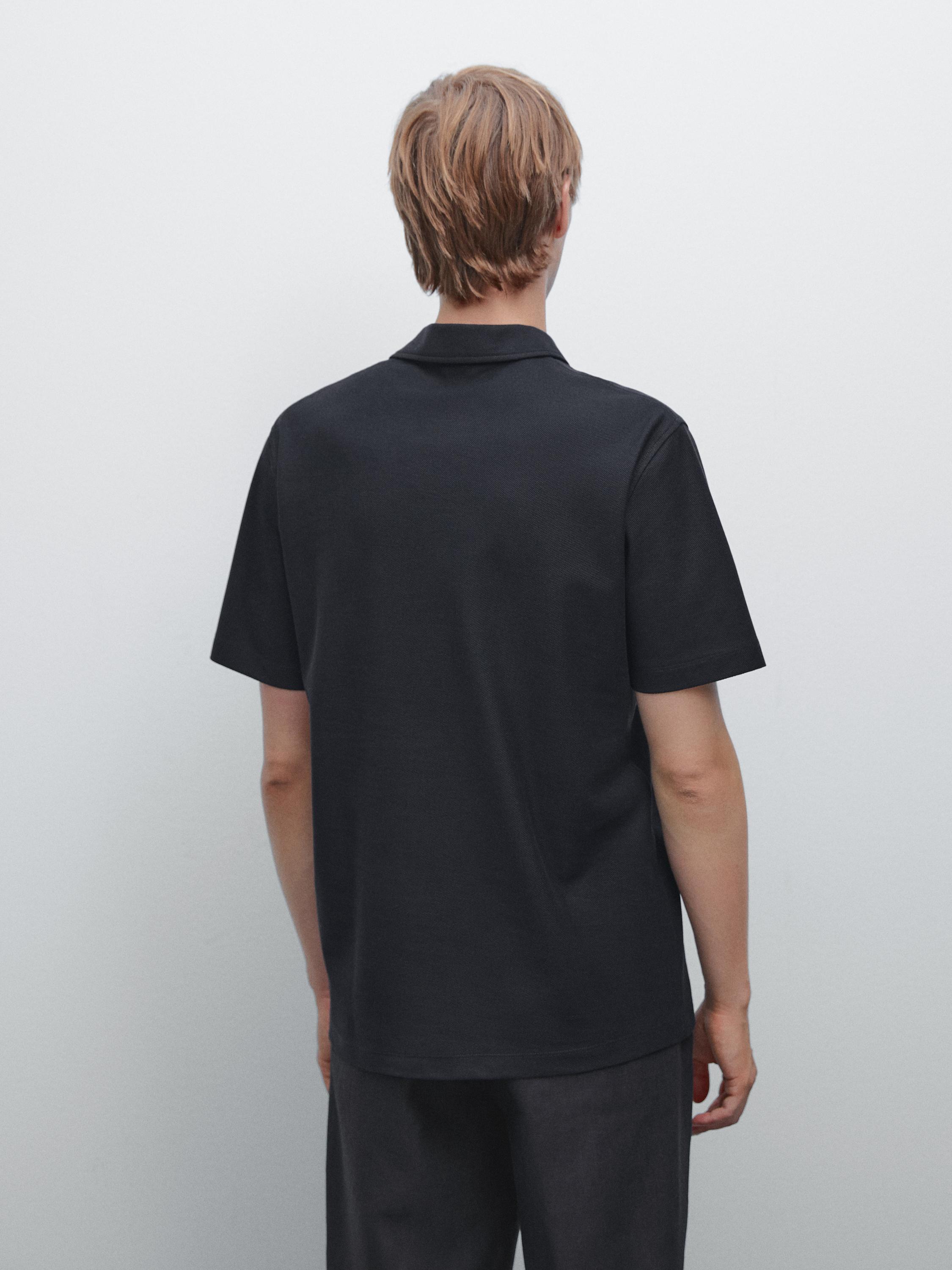Textured polo shirt with hidden button
