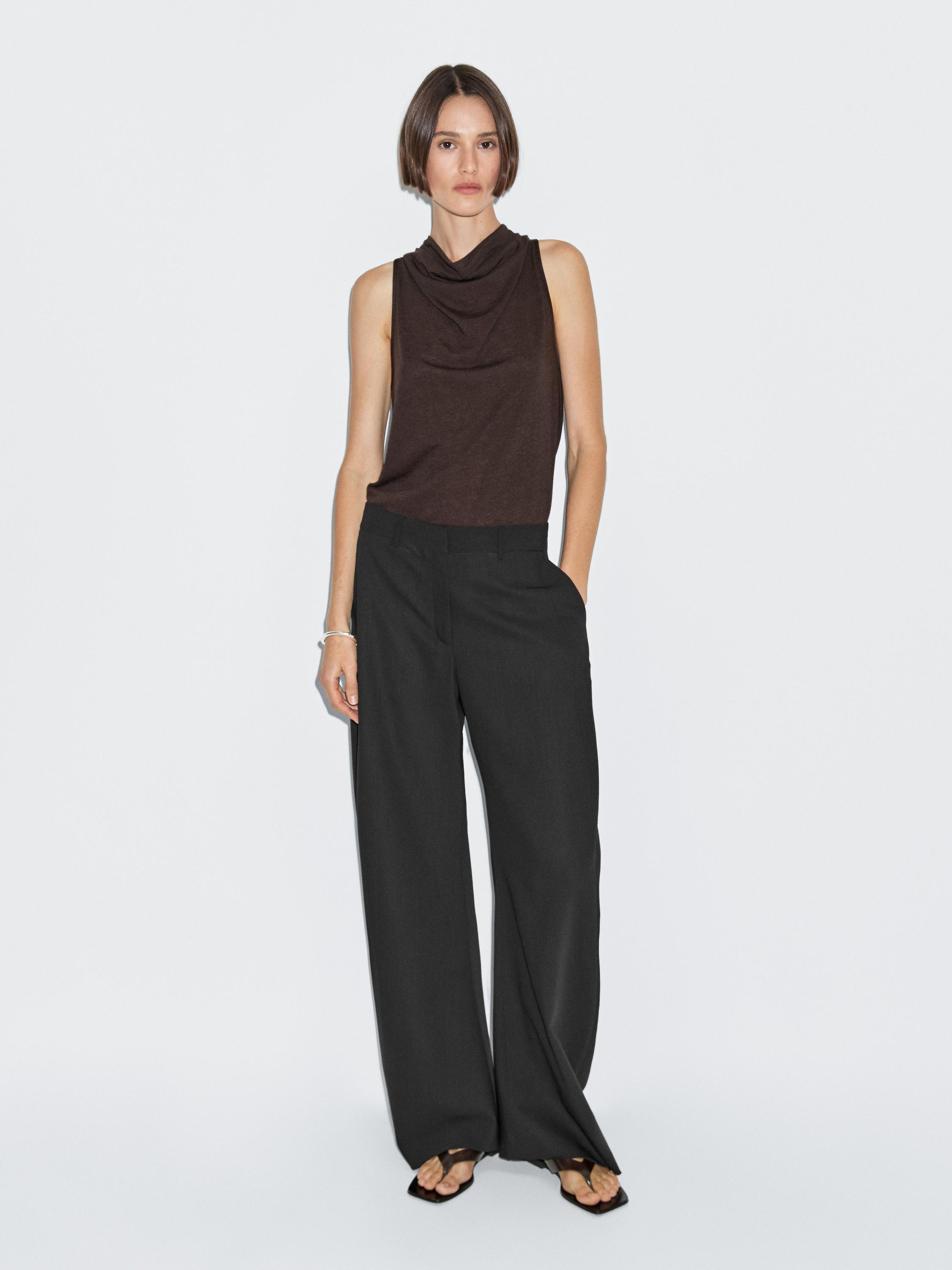 Sleeveless top with draped neckline