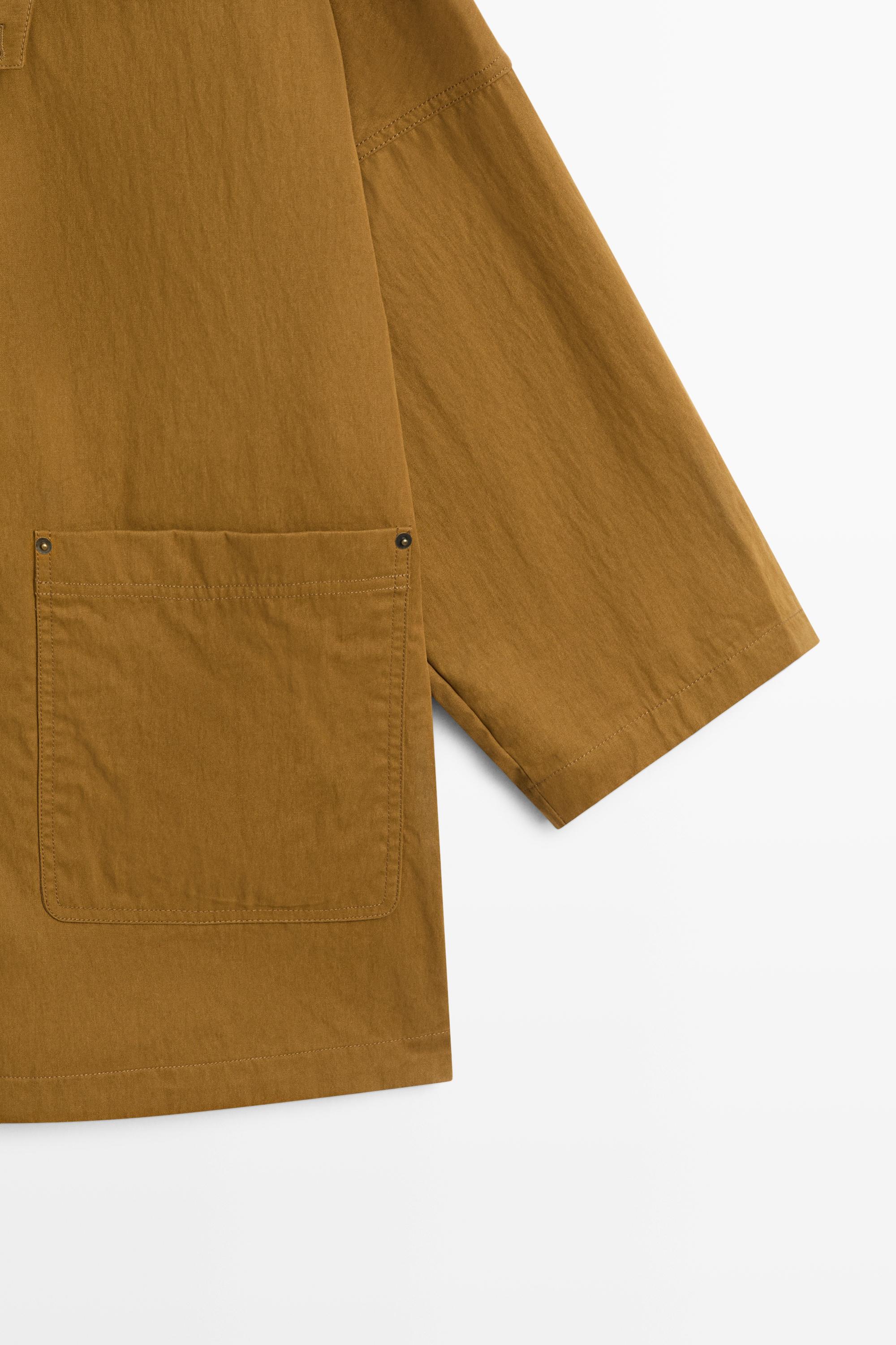 Button-tab cape jacket — 0-013