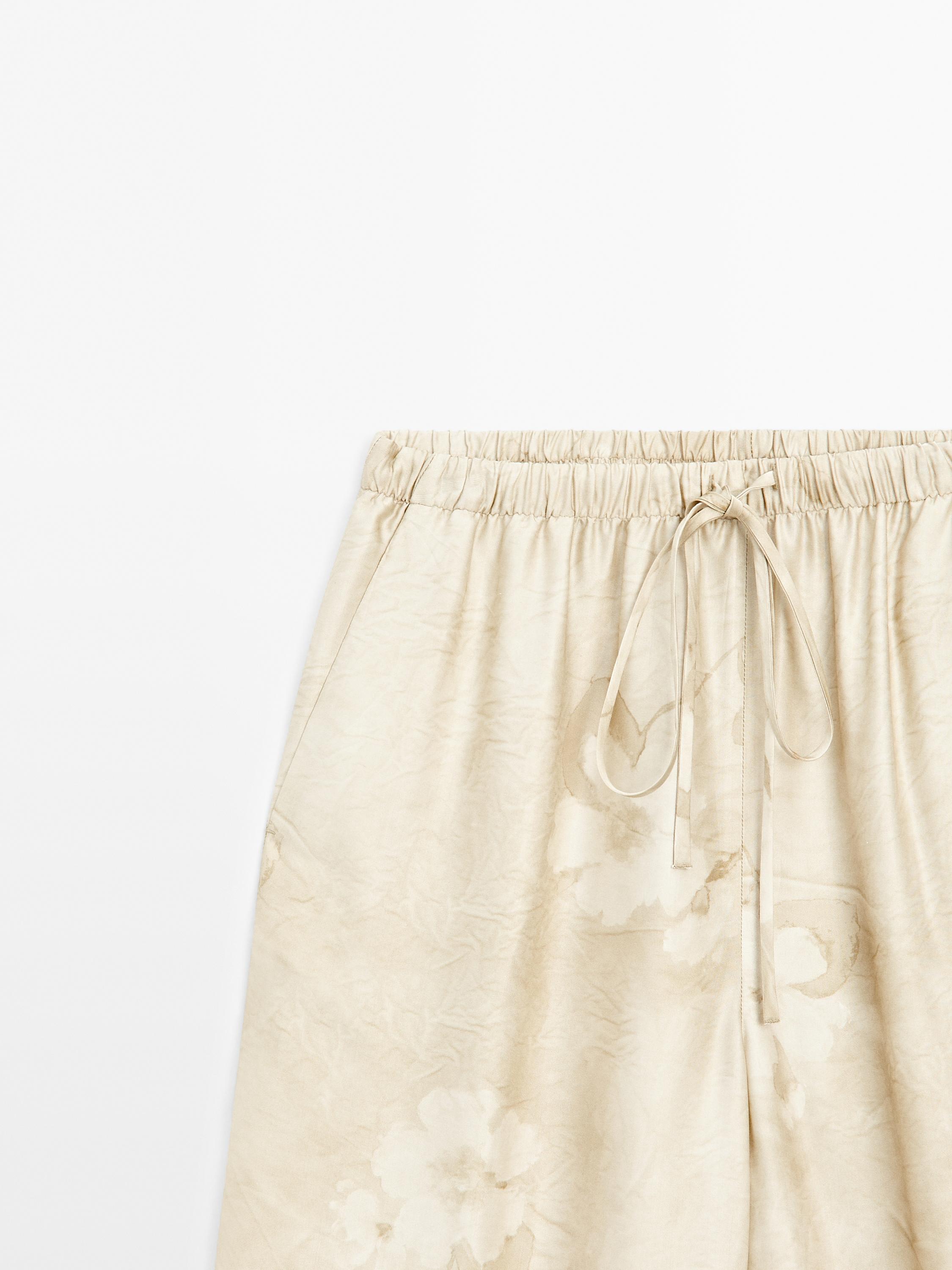 Flowing printed trousers with drawstring detail