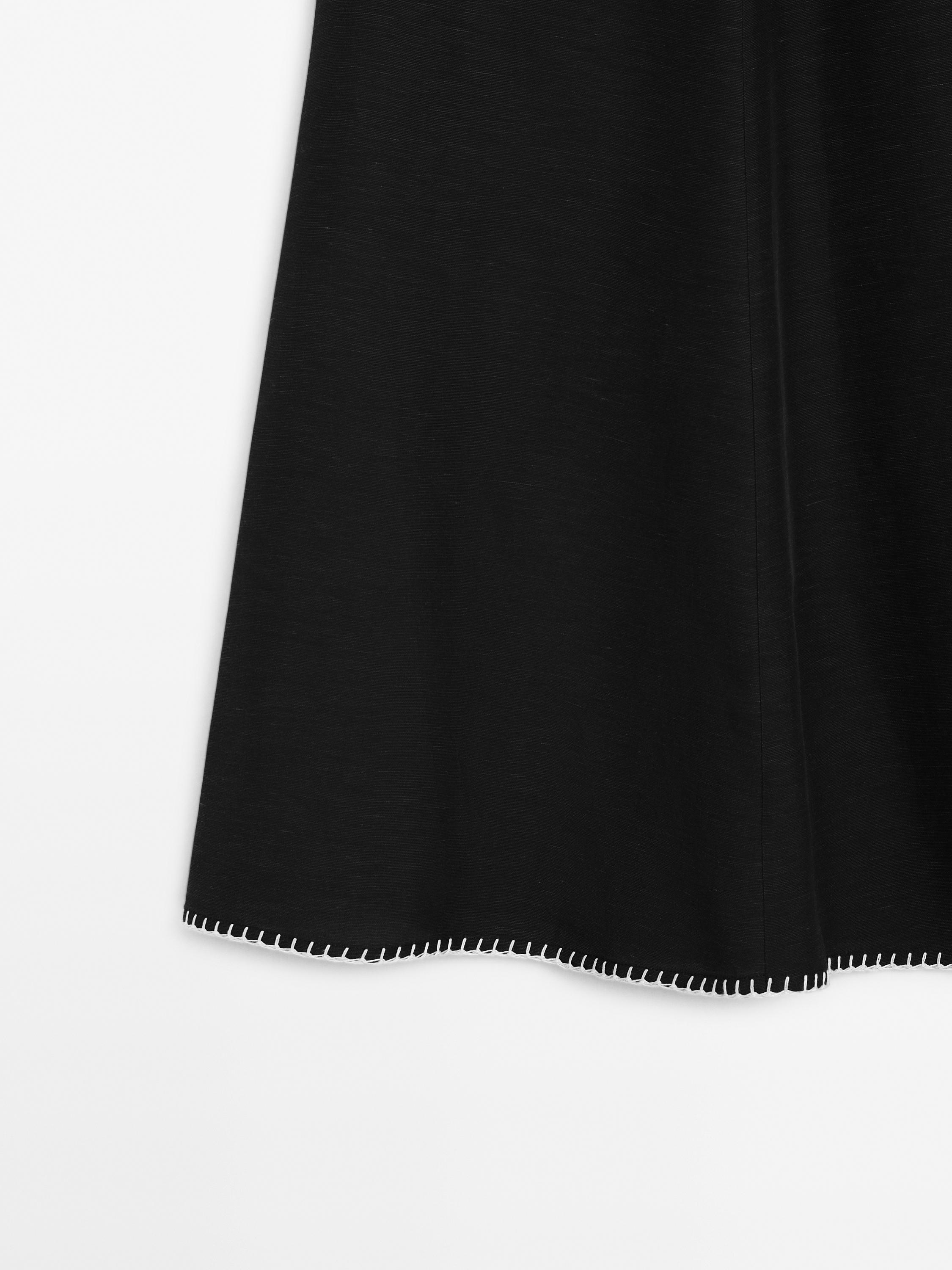 Midi skirt with topstitching detail on the hem