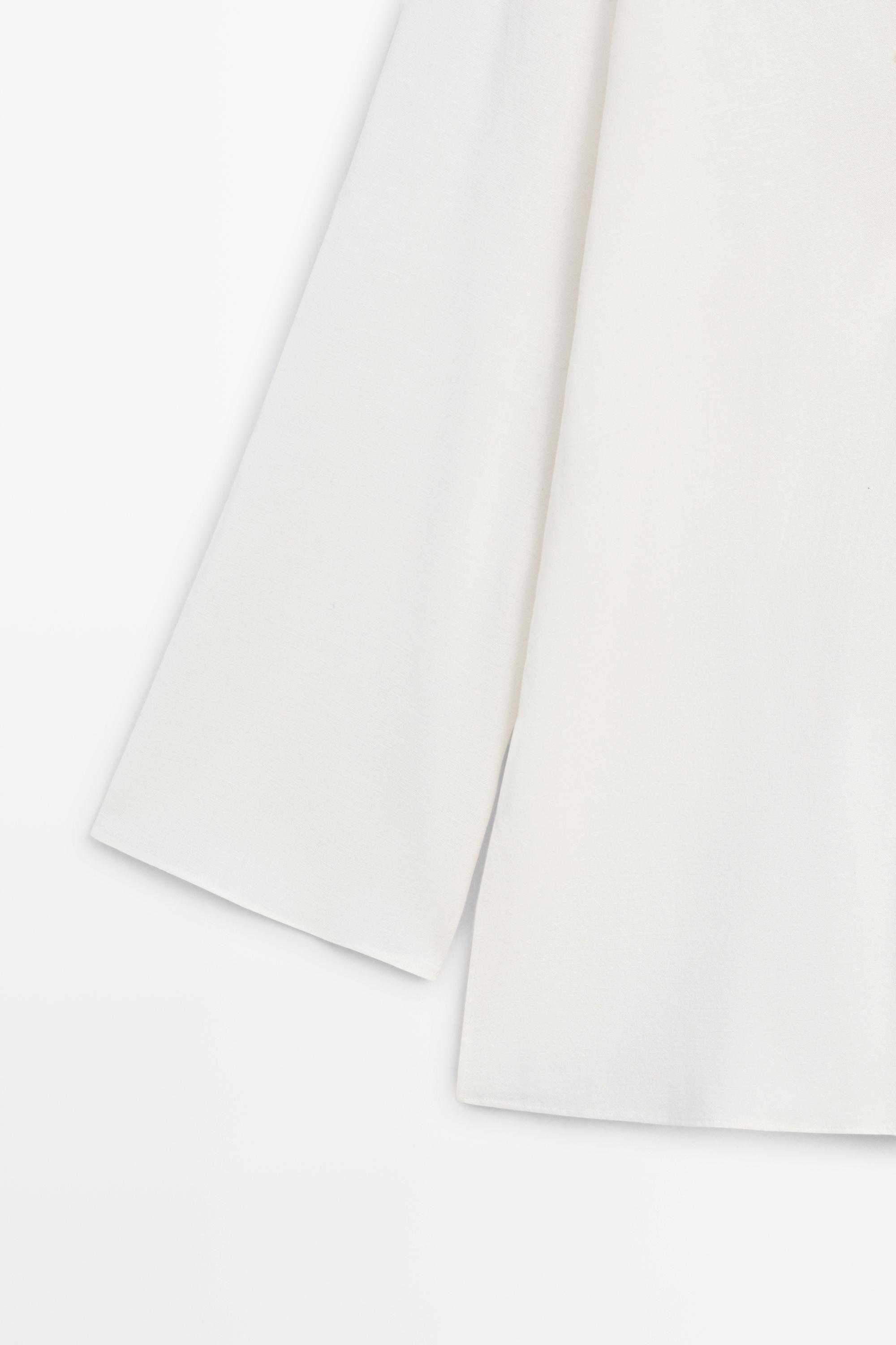 Flowing oversize blouse with stand collar and embroidery — CREAM