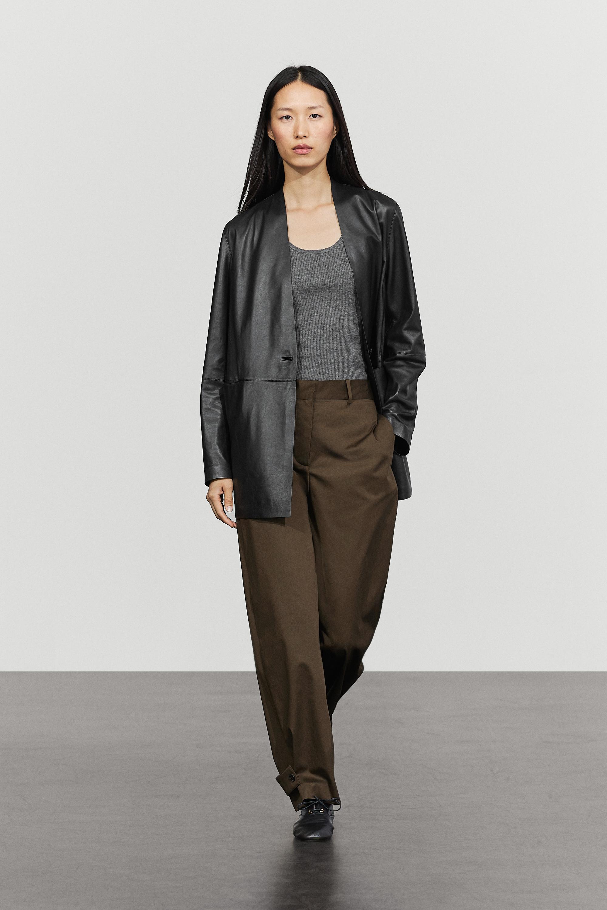 Pants with buttoned hem detail