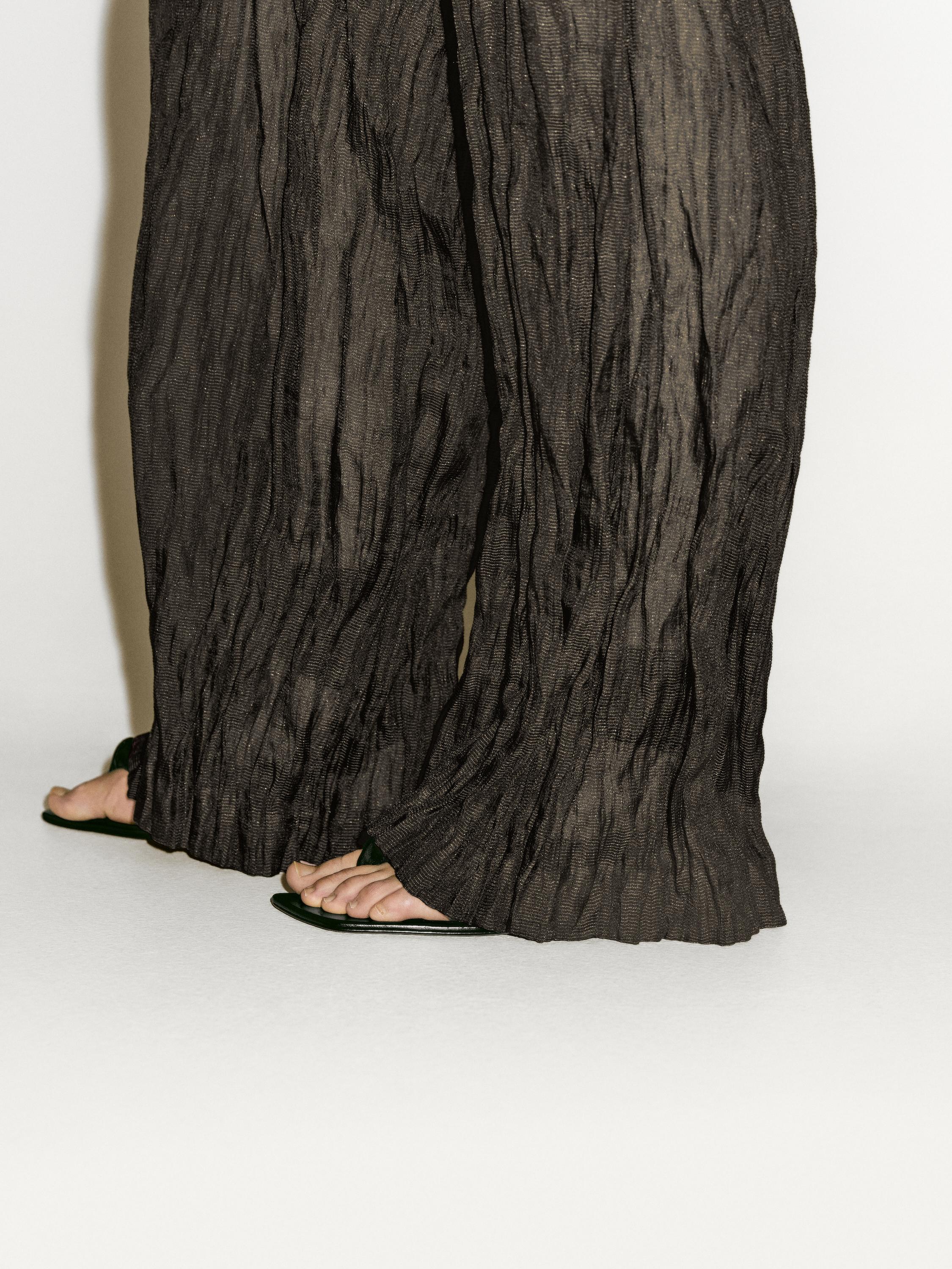 Creased-effect flowing trousers - Limited Edition