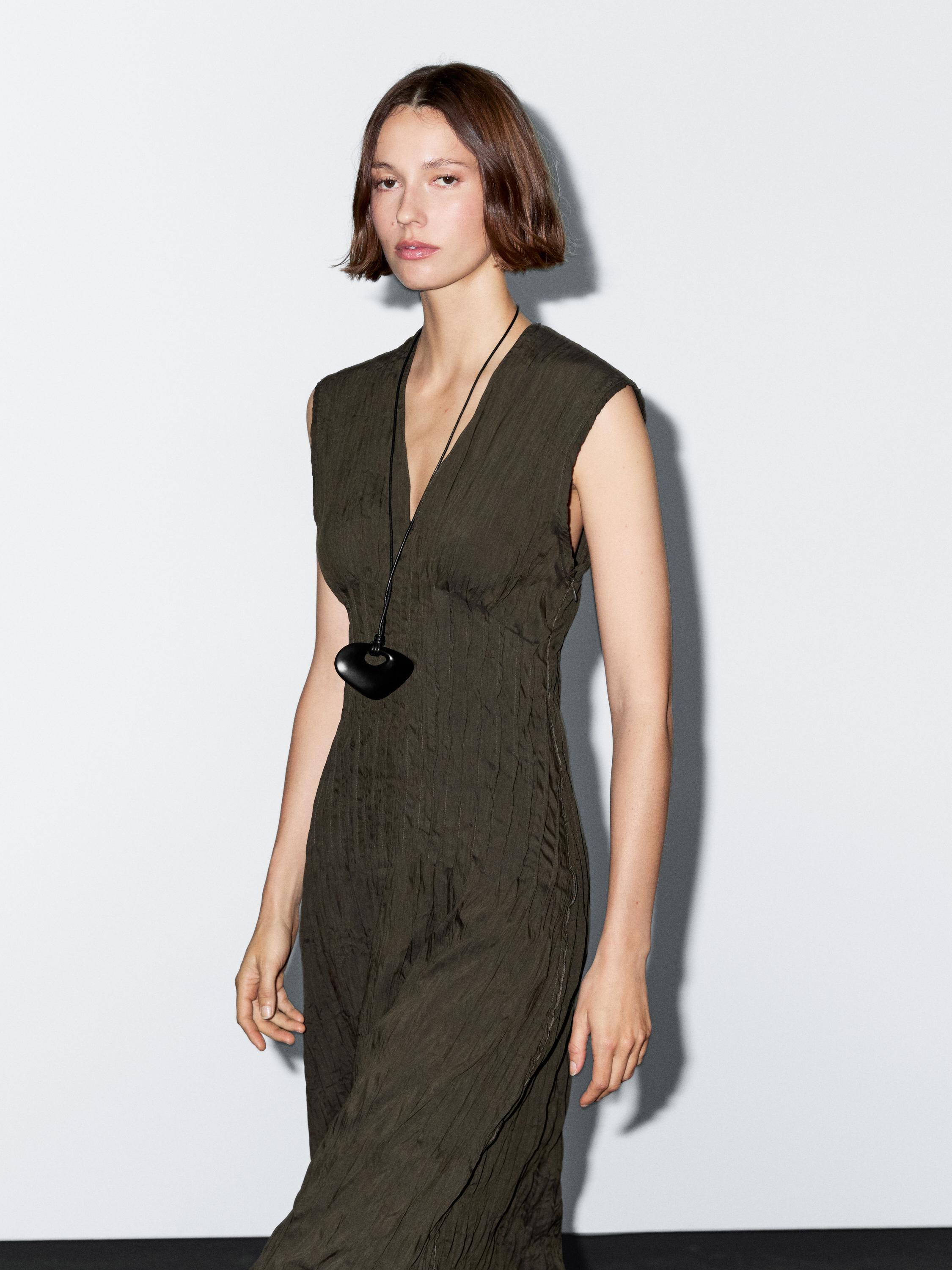 Creased-effect long pleated dress