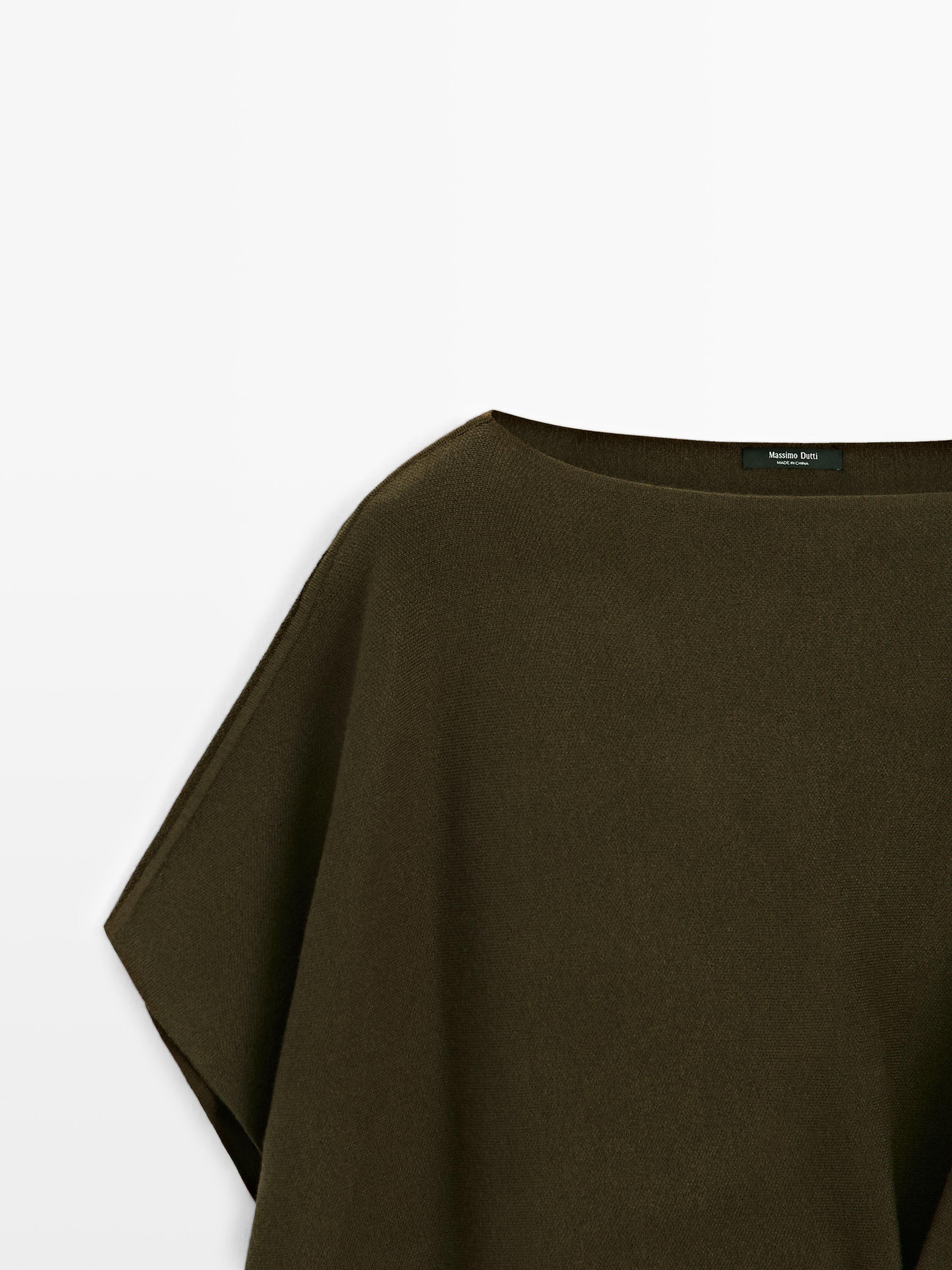 Knit cape with brooch detail