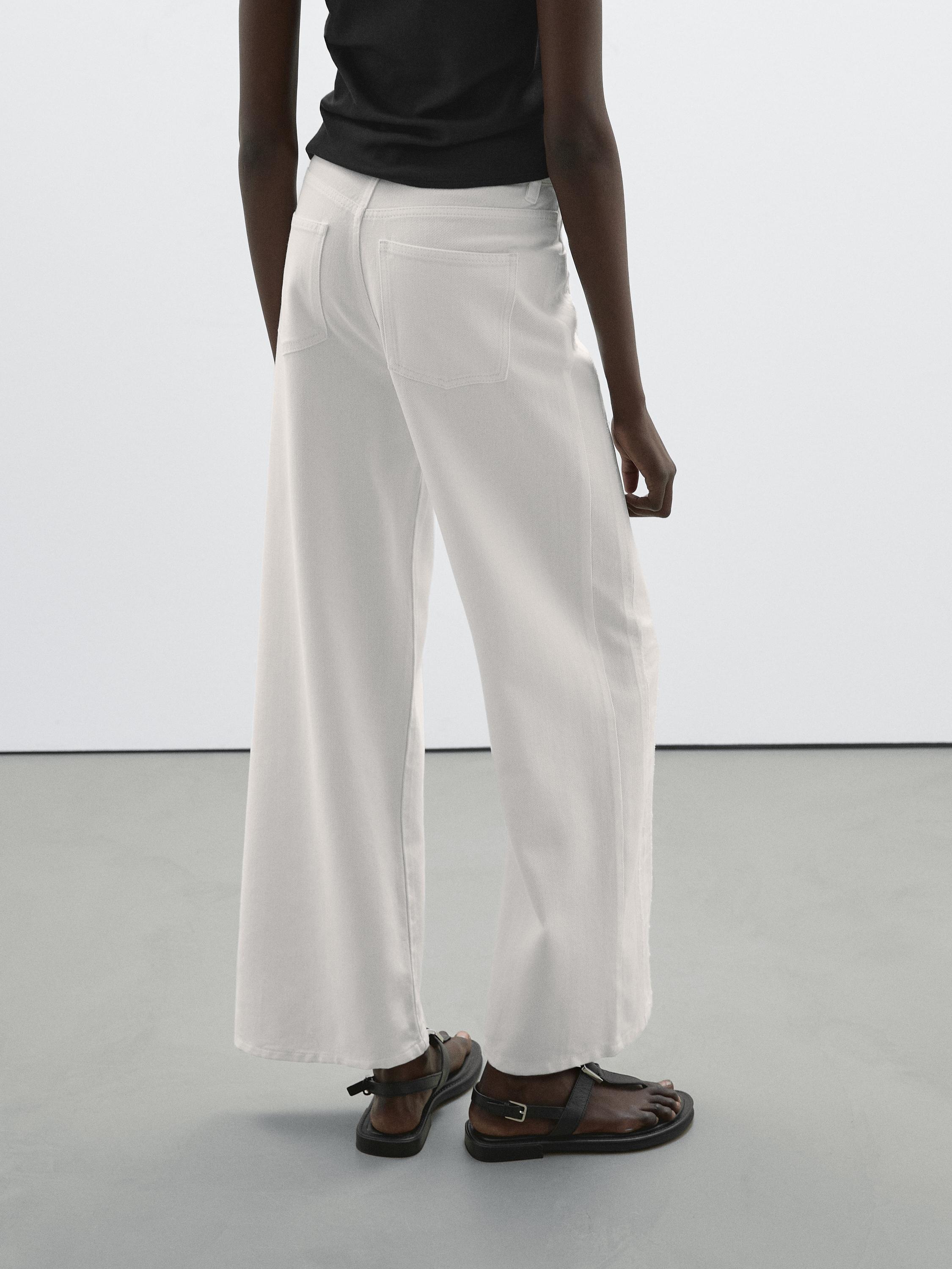 High-waist wide-leg jeans with seam details