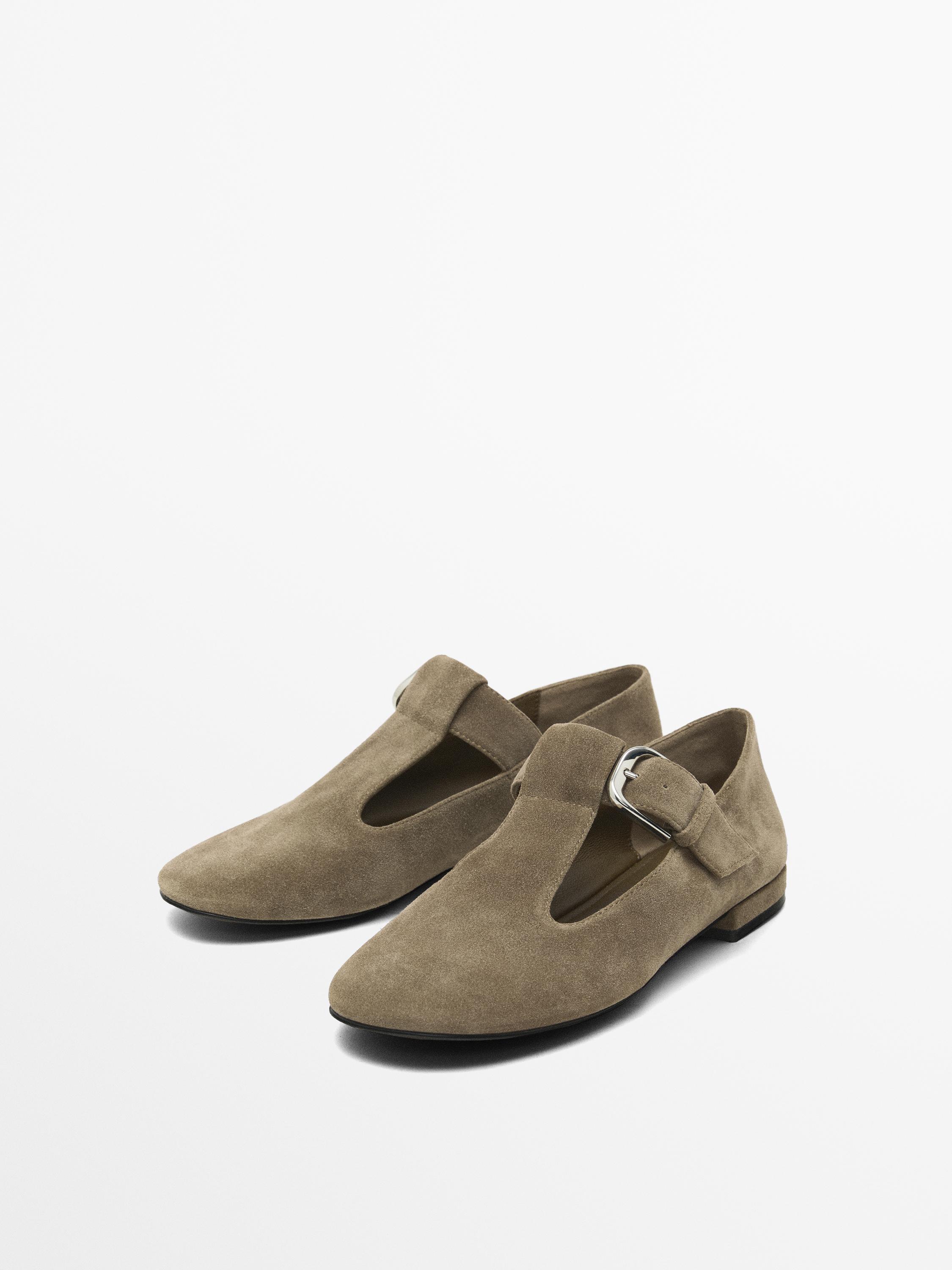 Flat shoes with buckled strap