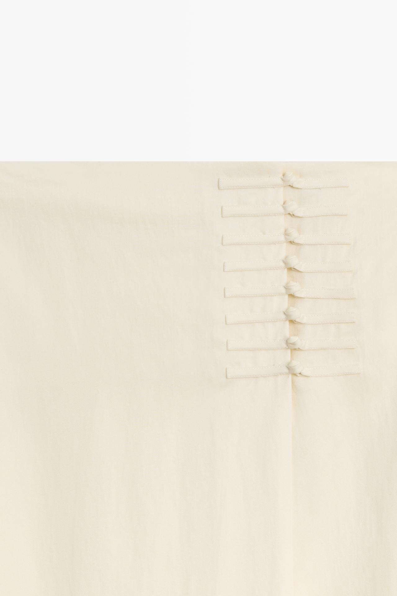 Straight midi skirt with button detail — CREAM