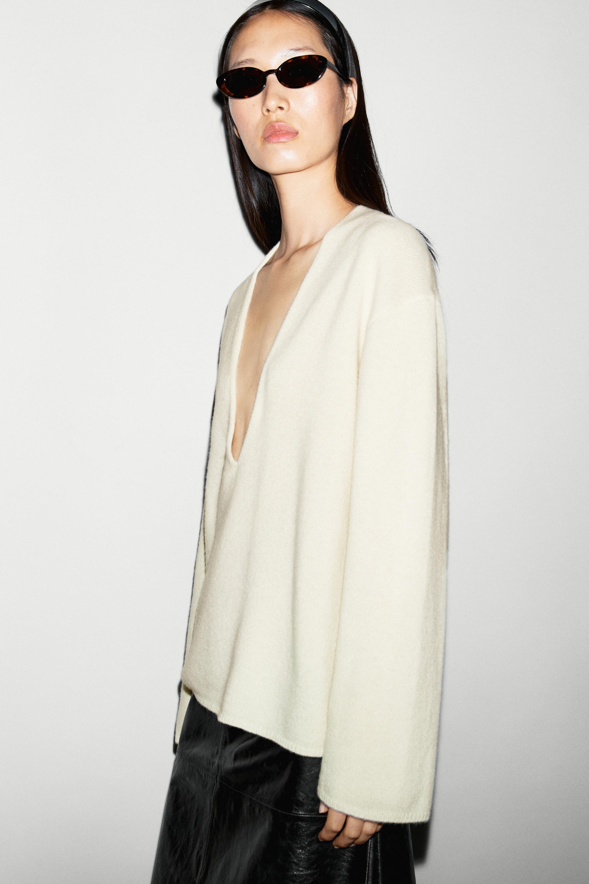 Long-line knit sweater with neckline detail — OCHRE MARL