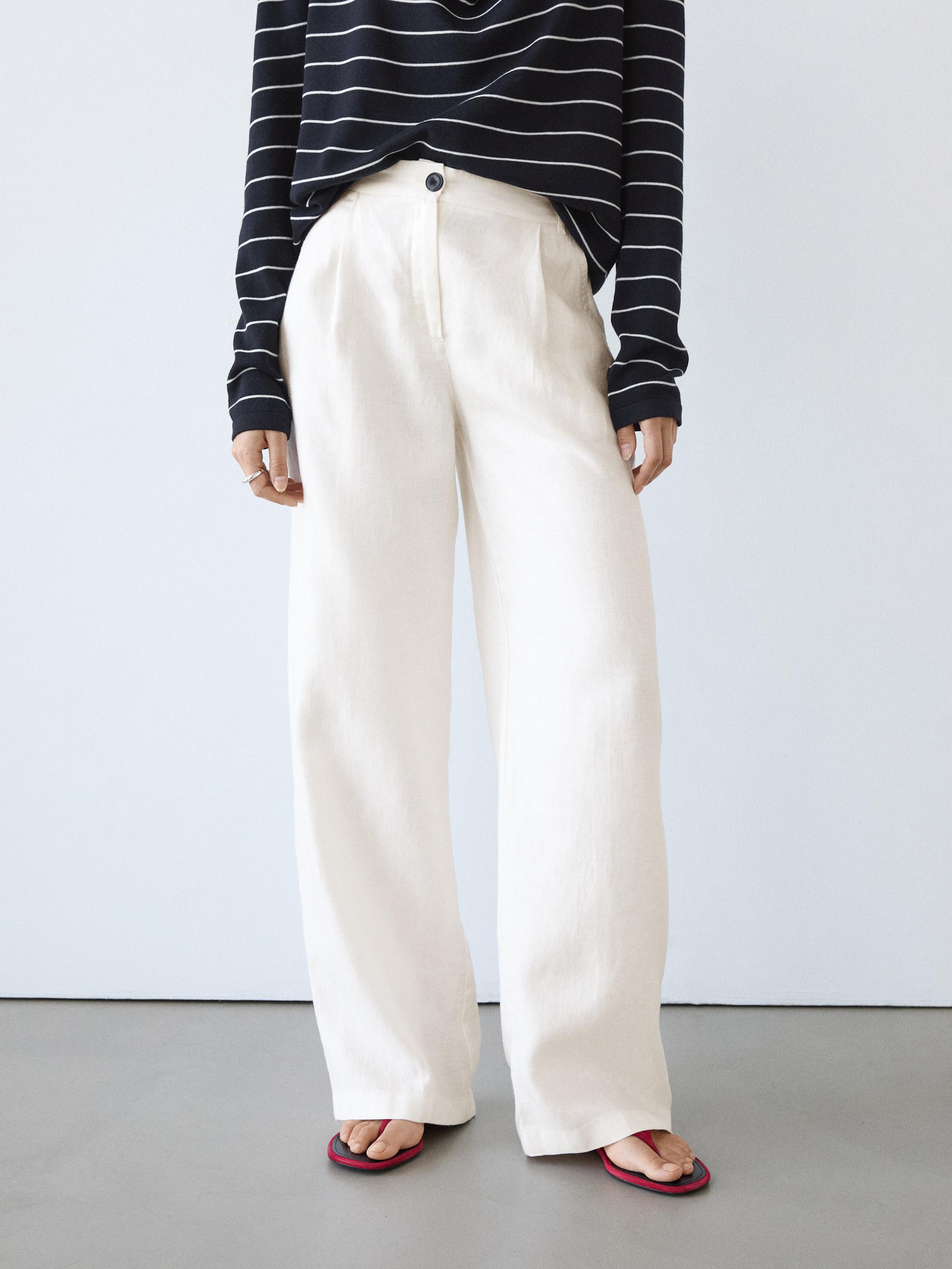 wide-leg pants set with front button and black and white striped t-shirt.
