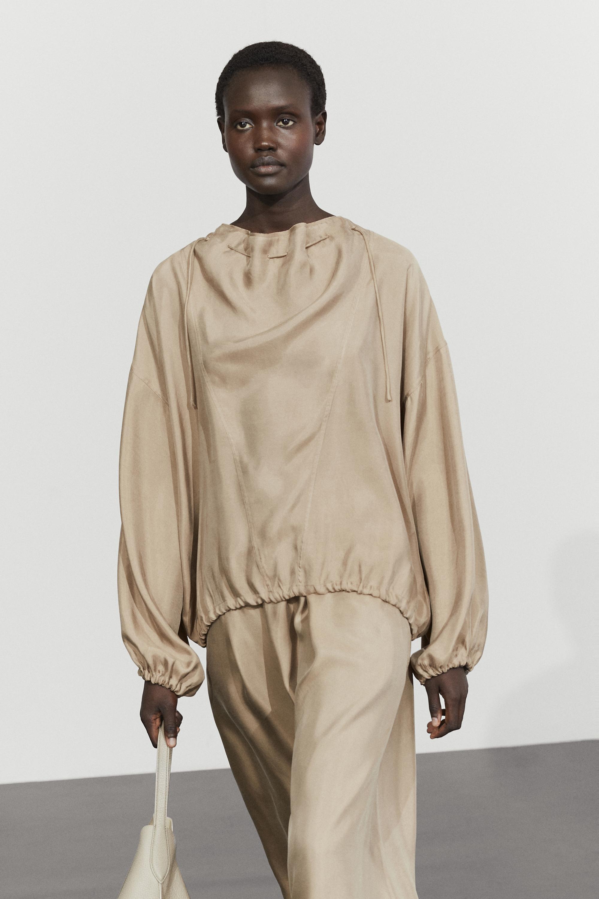 Flowing blouse with drawstring neck detail