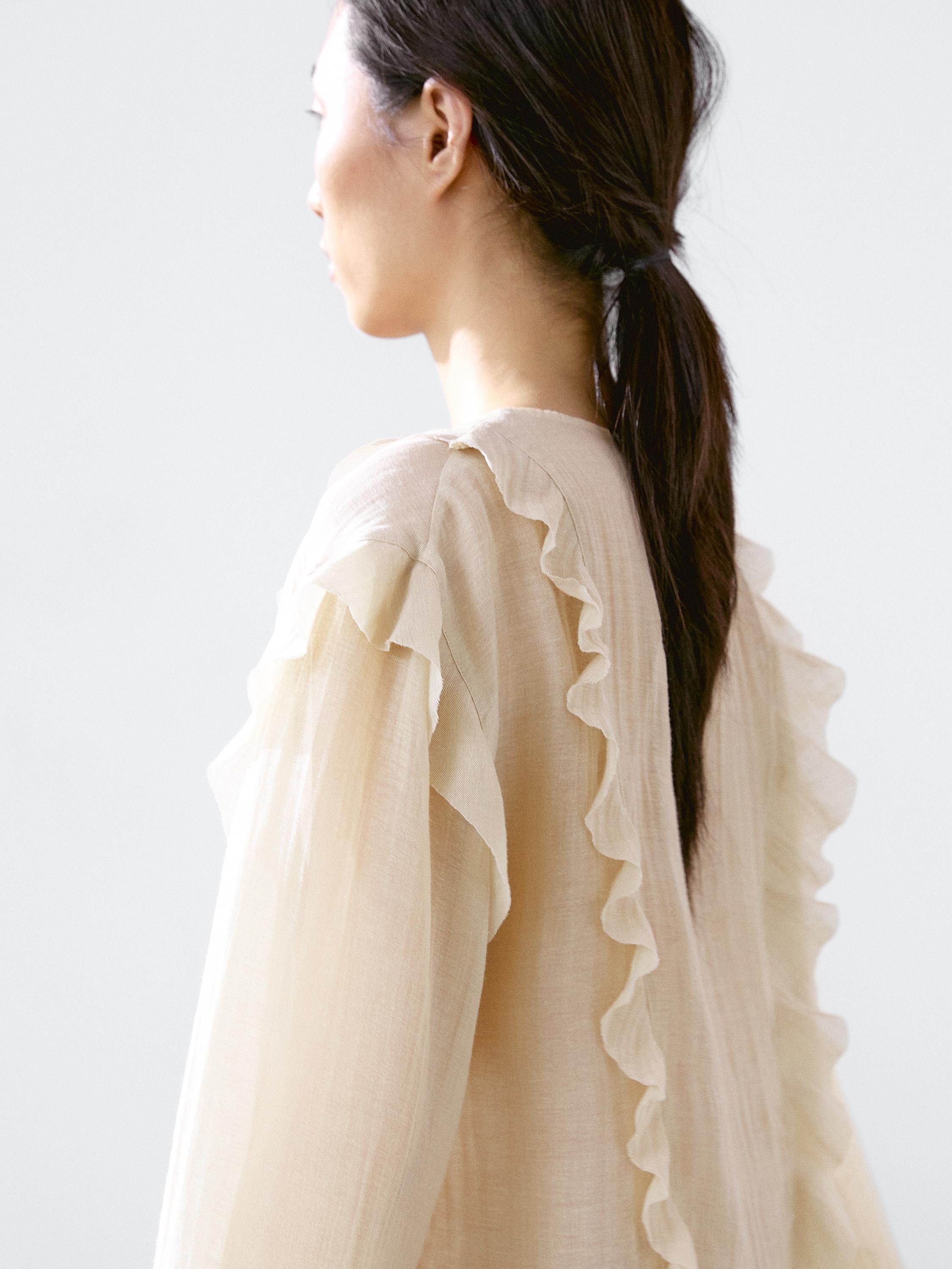 Flowing blouse with ruffles
