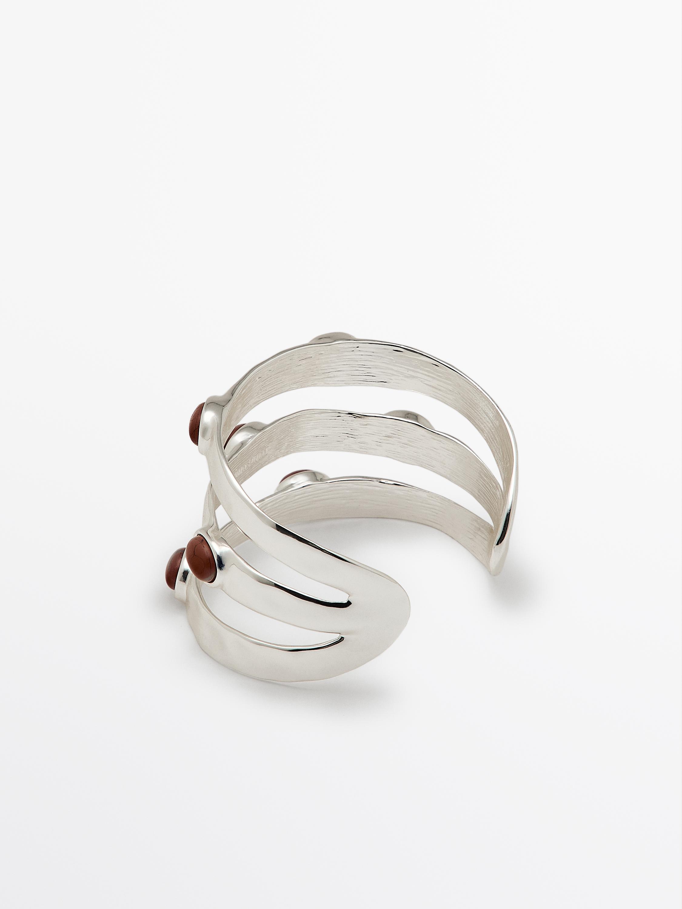Wide bracelet with encrusted details