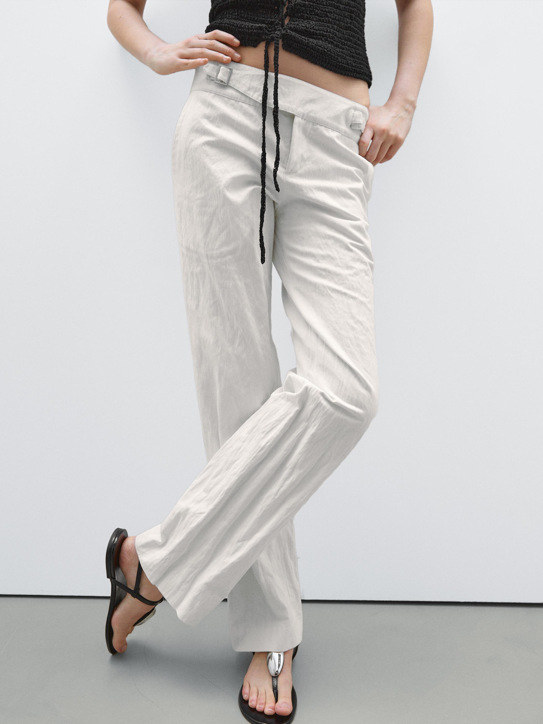 بنطلون ضيق بخصر منخفض وأبازيم