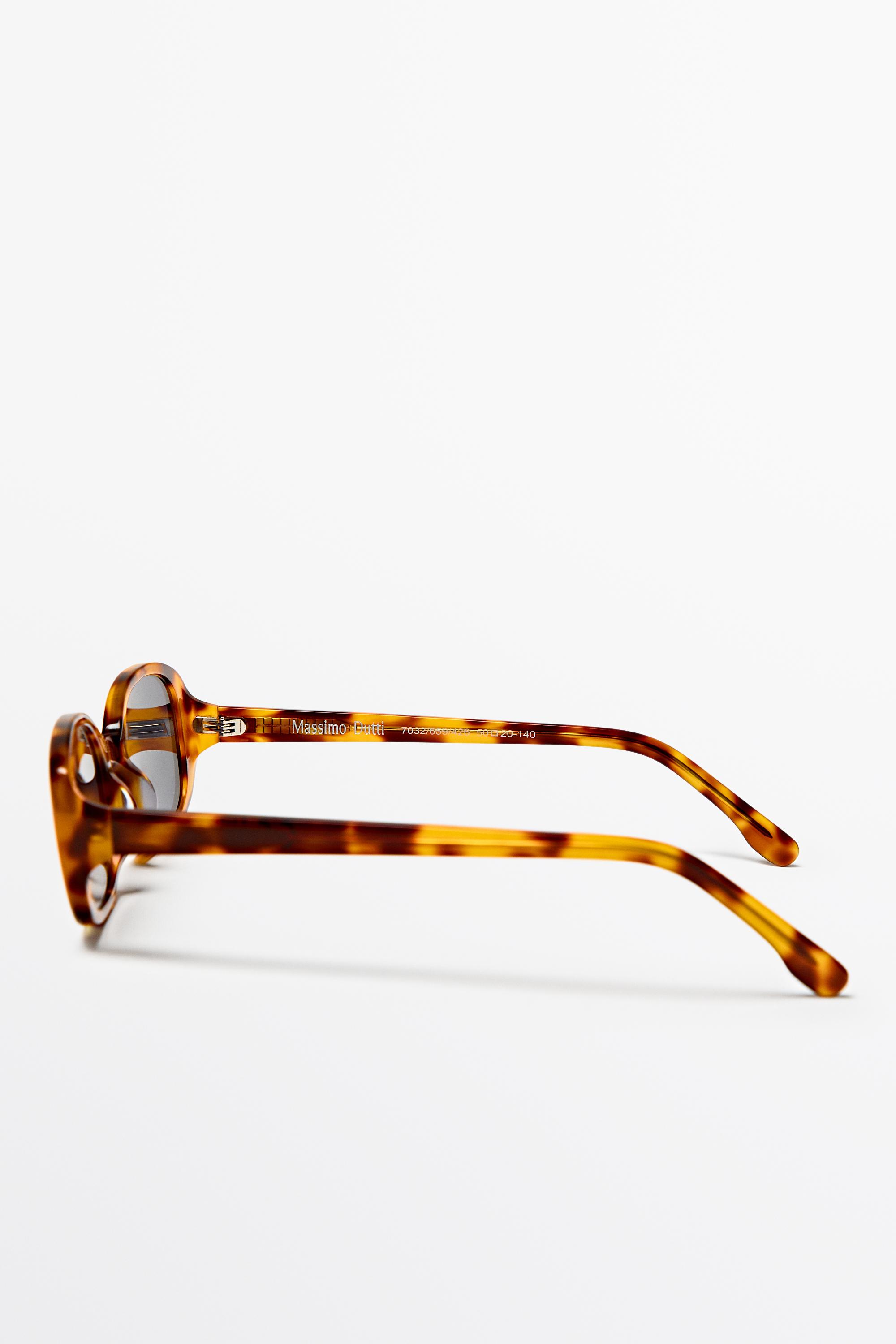 Oval tortoiseshell-effect sunglasses — Light Blue