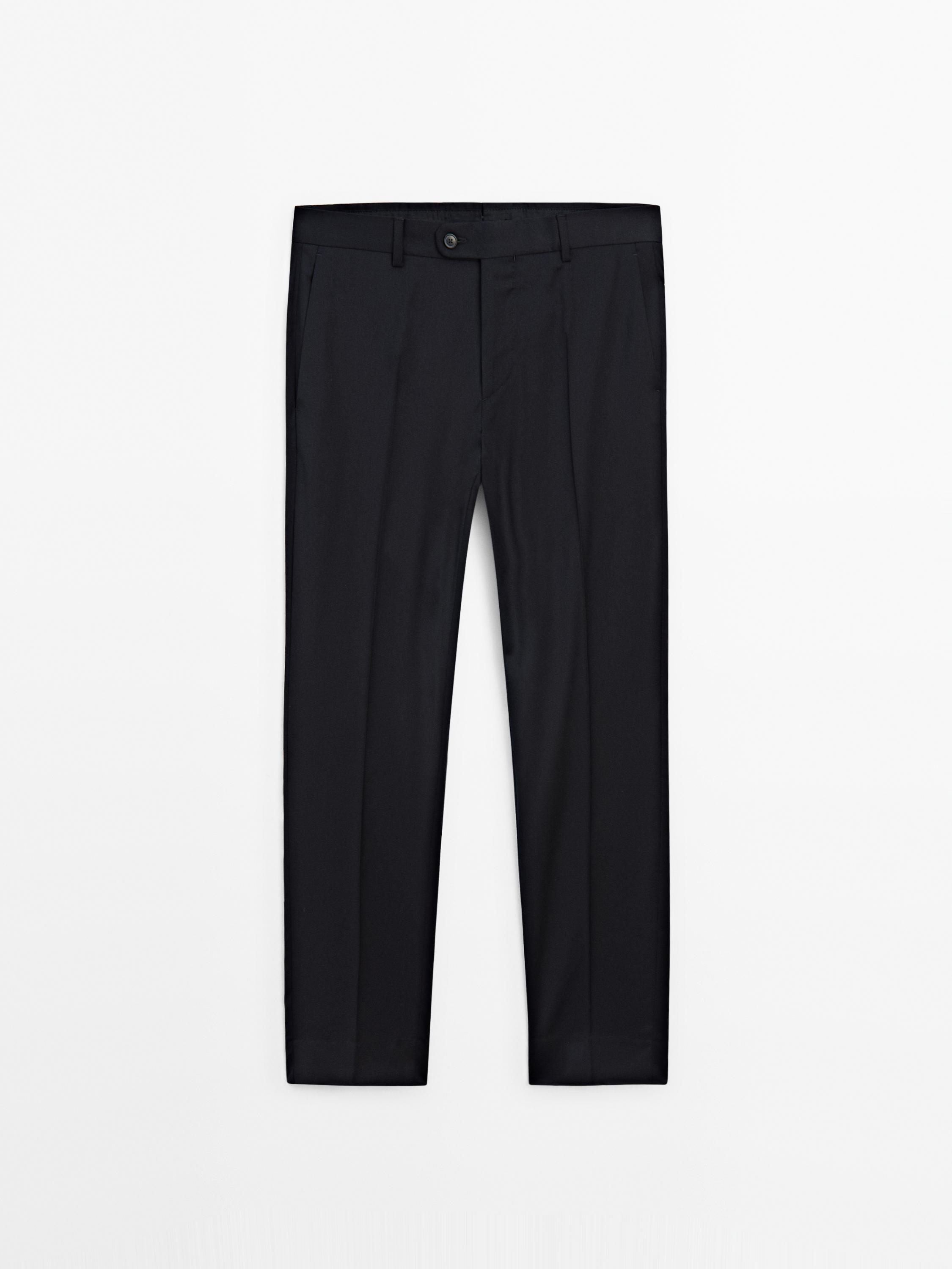 Front view of black trousers with side pockets and visible button.