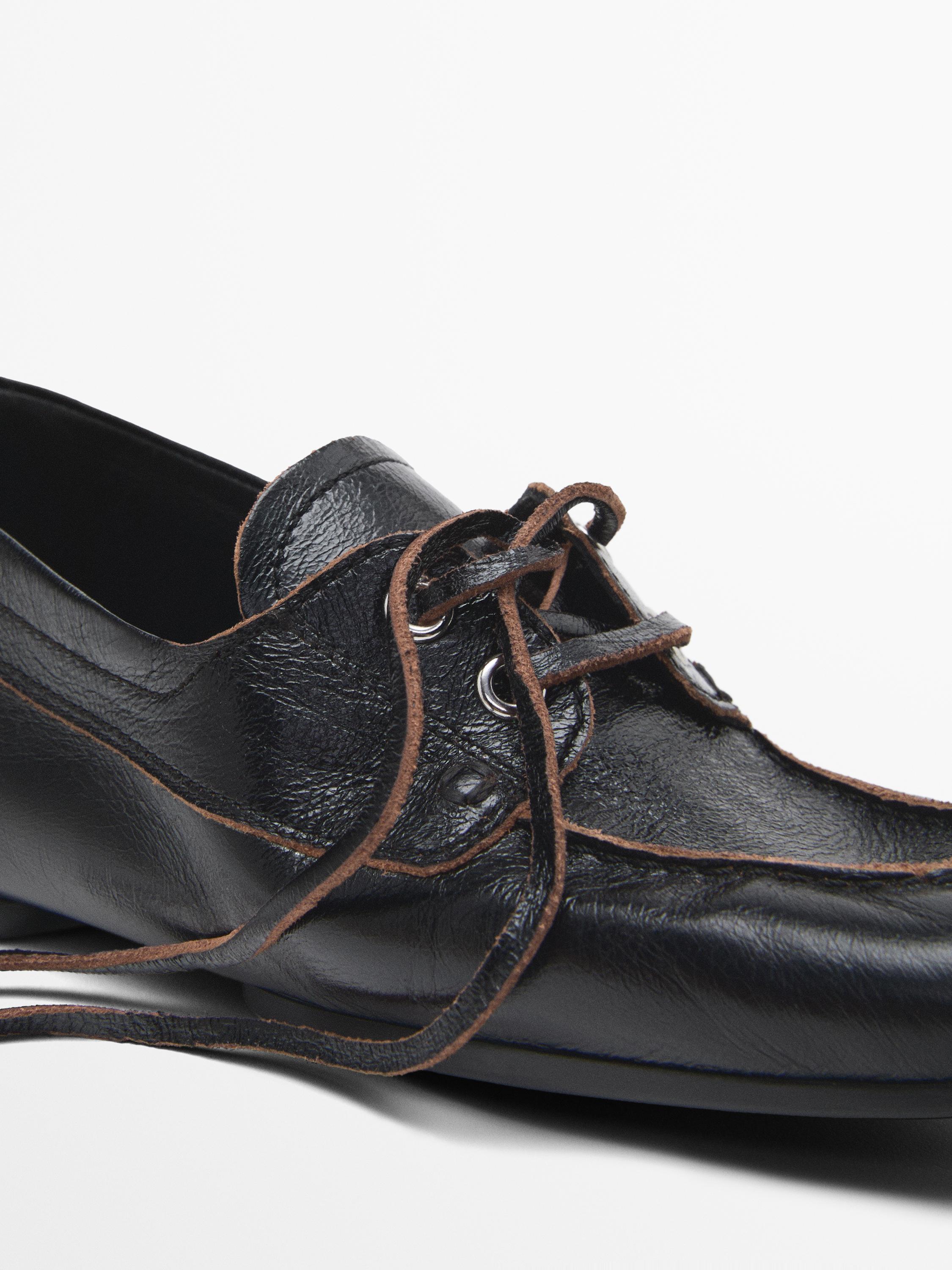 Shiny leather deck shoes
