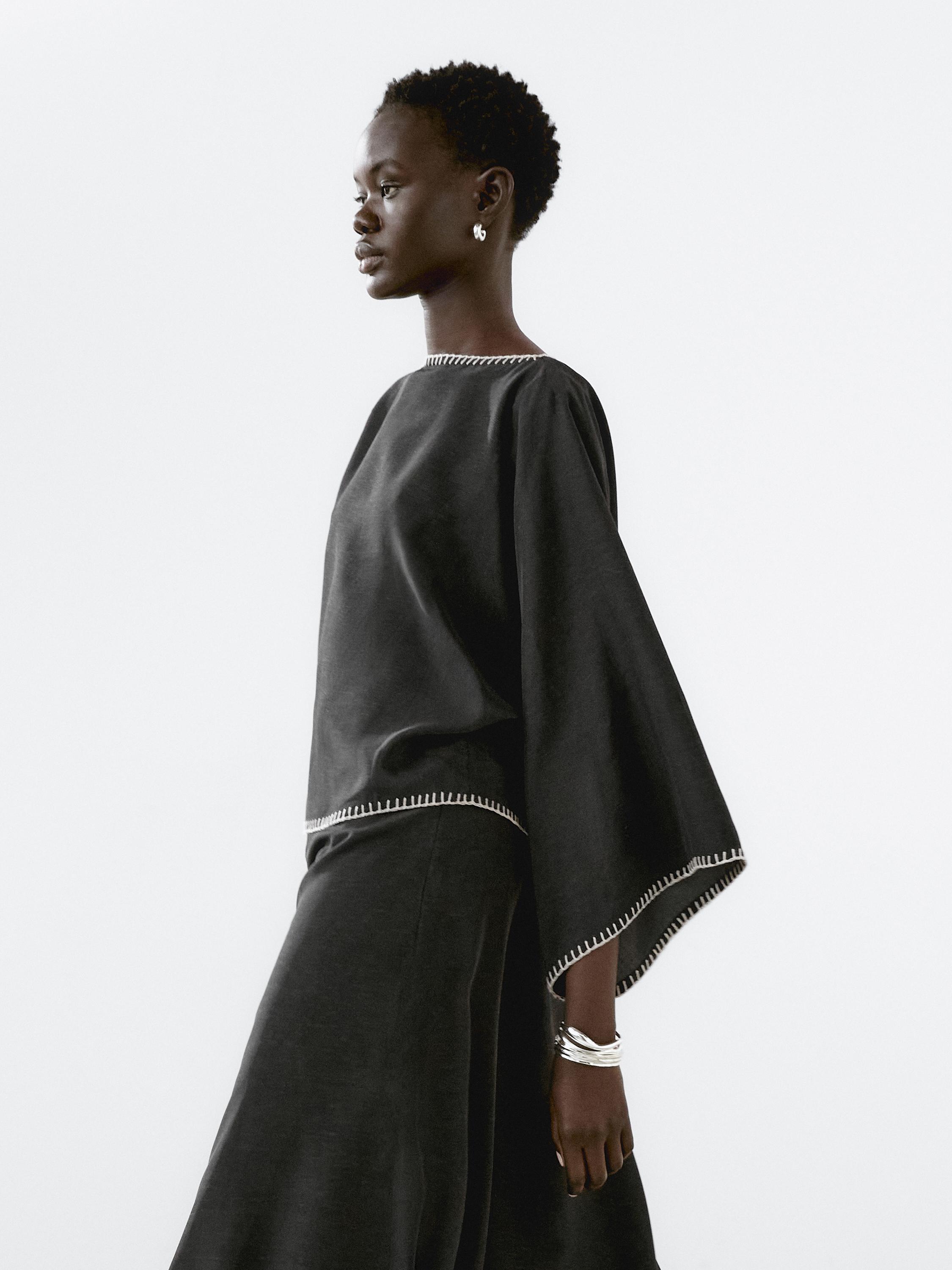 Cape blouse with batwing sleeves