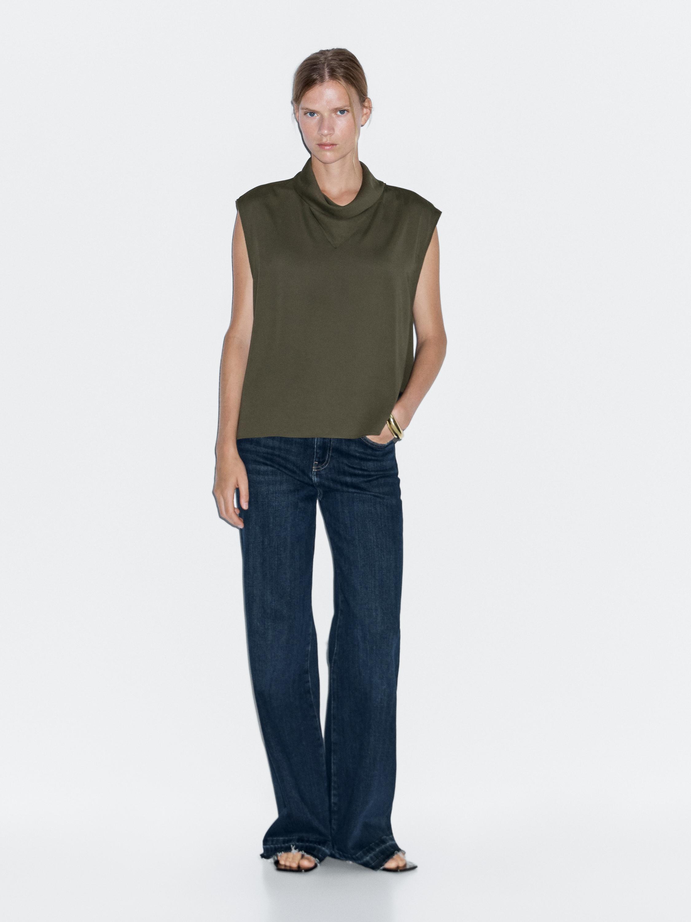 Flowing blouse with draped neck detail