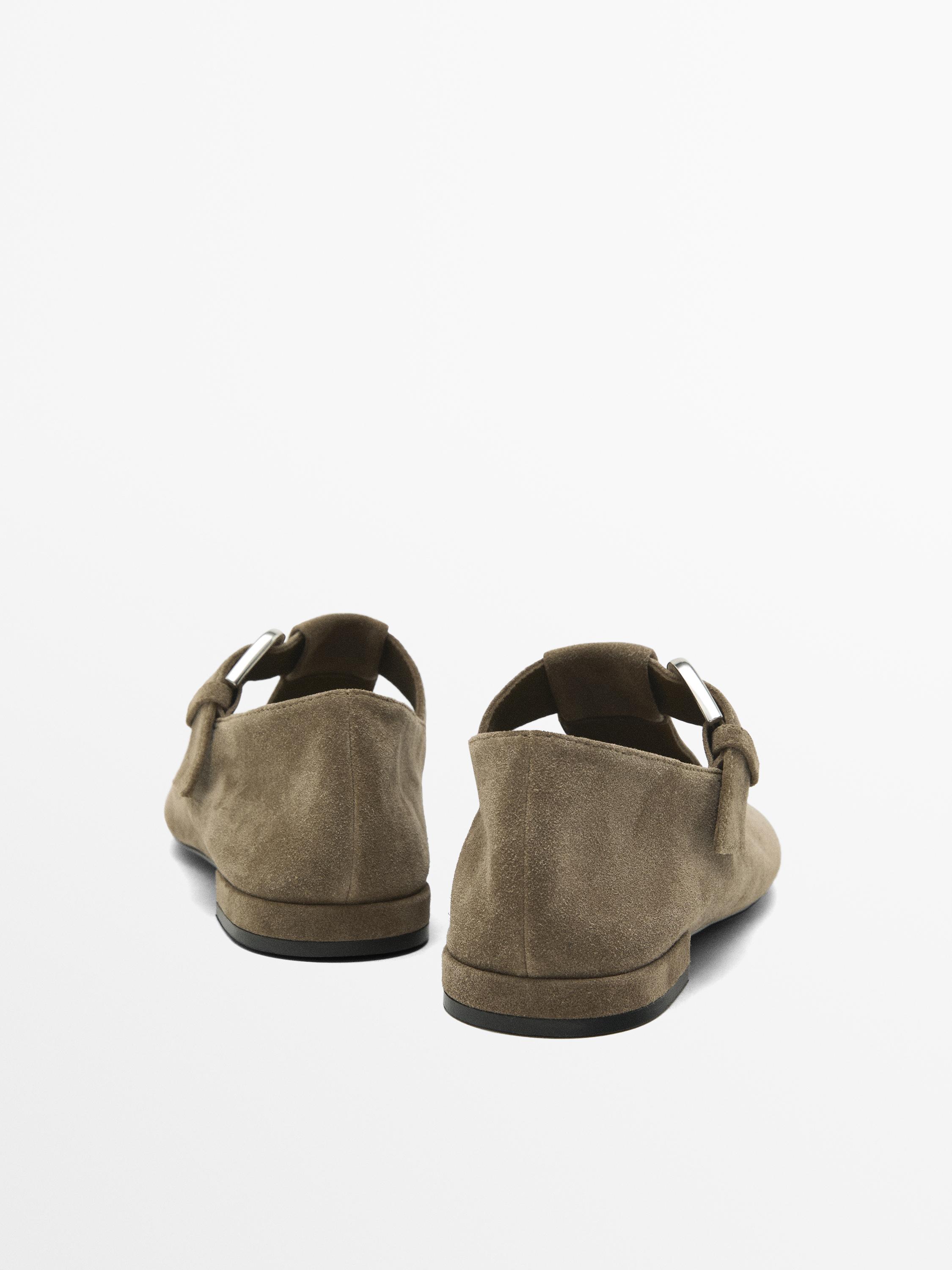 Flat shoes with buckled strap